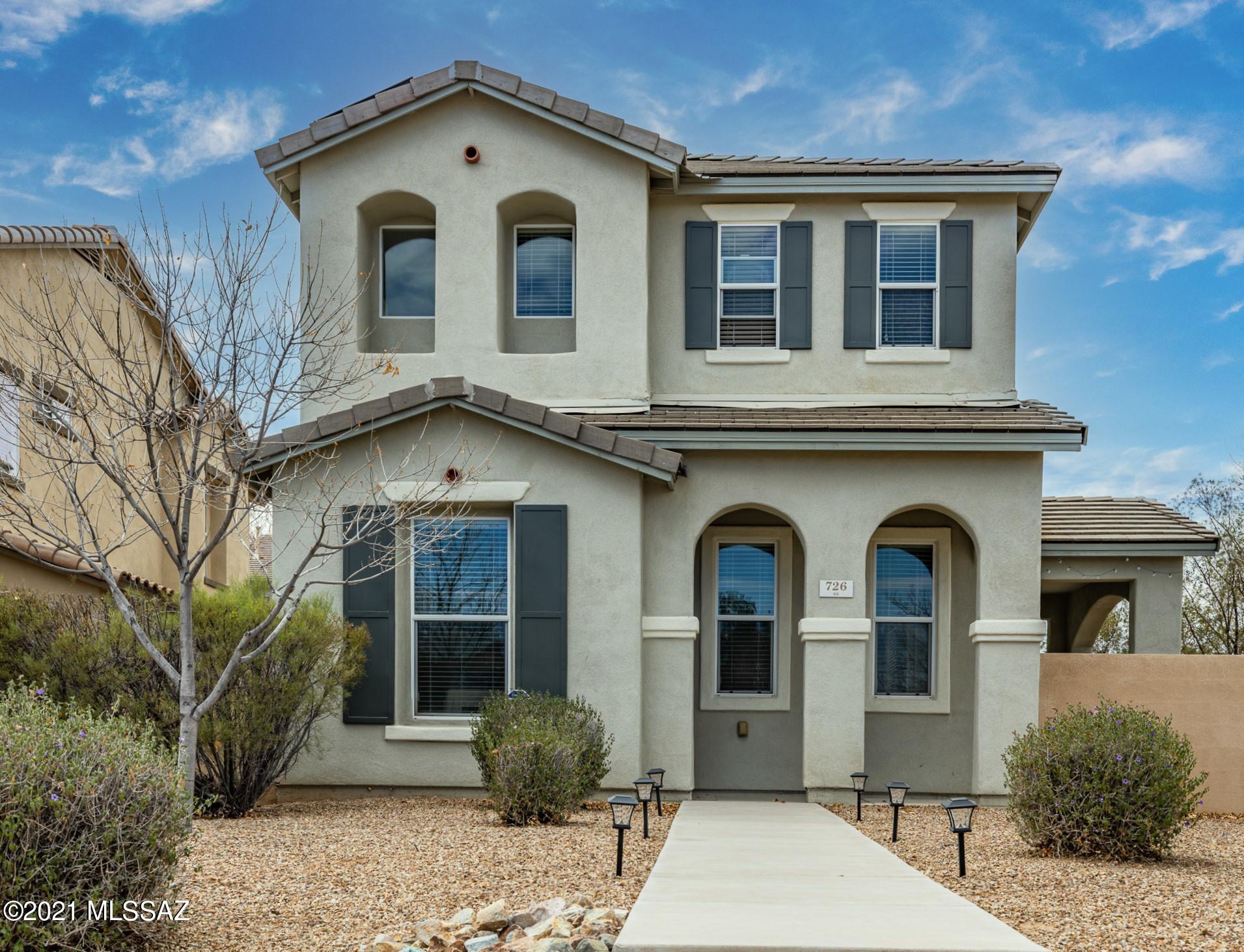 This 3 bed, 3 bath, 2-car garage home is nestled on a PREMIERE LOT, overlooking beautiful open space! There's only 1 direct neighbor, so you'll love the openness & privacy! The front yard landscaping is covered by the HOA! You're greeted w/beautiful stairsteps, mature vegetation &  a spacious covered front porch. You'll love the contemporary feel & gorgeous tile roof. The floor plan is open & inviting.  The home has tall ceilings, window coverings convey, ceiling fans thru-out, new garage door & motor! The kitchen is spacious w/a huge breakfast bar & extended height upper cabinetry. There's a downstairs powder room. You'll fall in love w/the HUGE owner's suite.  The bath has a walk-in shower, garden tub, & an executive height double sink vanity. The rear yard has a cover porch & flagstone!