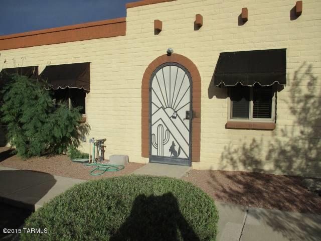 Great value in this quiet end unit.  New paint & carpet in the already updated 3 bedroom, 2 bath townhouse.  Many extras include low-e-pella windows, Jacuzzi tub in bath, extra freezer, security bars.  Mature covered patio with fountain.  All this across from lovely pool with picnic tables, BBQ & mountain views.  Community located near to Pima College, St. Marys' Hospital, U of A, trolley car, restaurants & shopping.