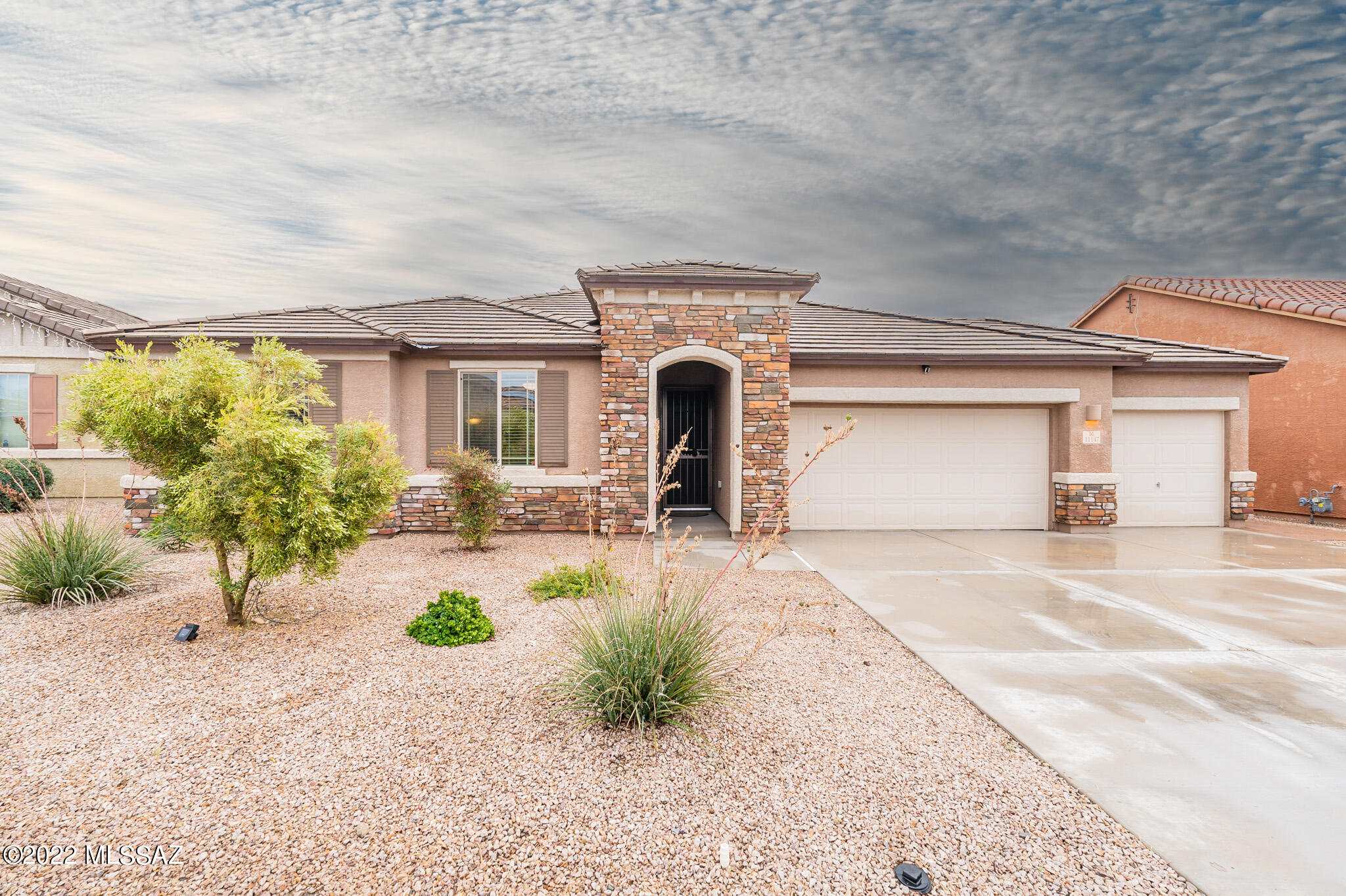 Looking to buy a turn-key home under the appraised value? Look no further and check out this stunning home located in the San Lucas community. This 2,100 sq foot home is a 3 bedroom, 2.5 bathroom home includes a den and a spacious 3.5 car garage. A spacious open floor plan with high ceiling that features a gourmet kitchen with an extended island, granite countertops, stainless steel appliances, dual ovens, a pantry and glass tile backsplash. The home includes a three-zone controlled Nest thermostat and has built-in surround sound speakers in the kitchen/living room area. The owner's suite includes a custom walk-in closet, double-vanity sinks with executive height counters and a spa-like oversized shower. Take a step outside and enjoy your morning coffee while shaded below the extended, covered patio. The backyard includes pavers, a fire-pit, artificial turf, a vegetable garden, fruit trees and a shed.