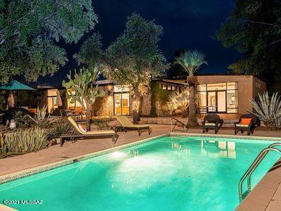 A superb example of midcentury desert architecture, this house was created by noted Tucson architect John H. Beck, AIA in 1962. Situated at the end of Potter Place cul-de-sac, the property features a three-bedroom home designed around a dramatic glass atrium, a detached office and a second-floor guest apartment. The home has been extensively restored, including a new open kitchen and a large master bedroom with en-suite bathroom. Listed on the National Register, the half-acre property includes a pool and extensive outdoor patios. Come thrive in the center of the city and live in an award-winning home full of light and youthful energy. A short stroll from the fabulous Arizona Inn, the house promises endless opportunities for entertainment and rejuvenation.