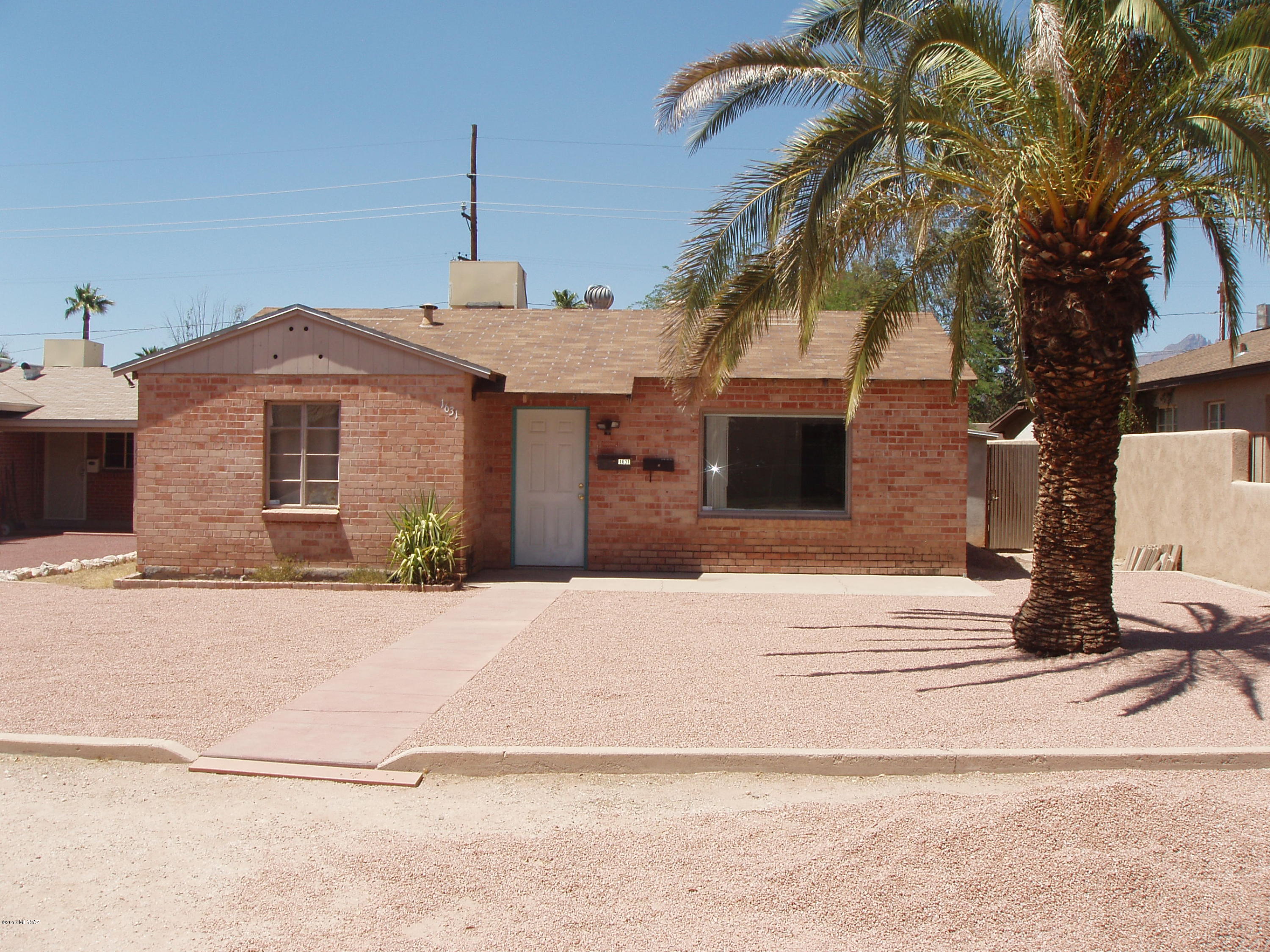AMAZING investment opportunity. Priced drastically reduced to sell – As Is. Strong CAP rate at just under 8% with easy opportunity to rent for more once current leases are up! Brand new roofs on both units!!! Terrific central location, walking distance to UofA & so much more! Wonderful brick main home with 2 bedrooms and 1 bath in 1,427 sf of open living space. Laundry room, newer water heater, new main bathroom, new pex piping and on and off street parking finish off this low maintenance fully occupied investment property. The back unit built in 1987 is a two story, 2 bedroom, 2 bathroom, 1,278 SF fully occupied home with electronic key code access, newer refrigerator, new toilets, extra-large showers, loft balcony and 5 off-street parking spaces. **See supplemental remarks** Tenants pay all utilities! Both leases are good through 7/2018. Both units have very strong tenant history â€“ Zero Vacancy, call and schedule showing today!
This property is being sold as a part of a portfolio. Other property is 2 streets away from this location. Please refer to listing at 1535 E Seneca for property information. Owner would prefer to sell both properties together but will sell separately.