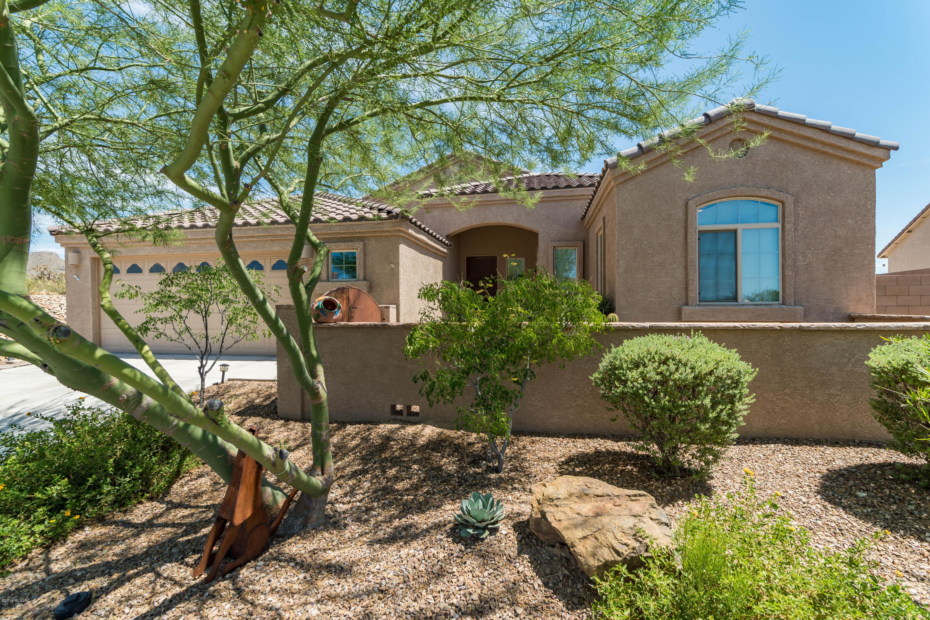 Great value for this lovely, spacious &  private Lennar Whitney model in gated Preserve at Dove Mountain. This highly desired great room concept home got a lovely kitchen facelift in 2018 w/new backsplash & added island/bar specialty tile work. Kitchen also has stainless steel appliances which all convey &  beautiful granite countertops.  This 3 bedroom, 2 bath home had new interior paint within the last couple of years. Master bedroom boasts 2 walk-in closets. Backyard is very private and serene - sounds of nature everywhere - a tranquil retreat - backs to natural desert habitat. Spacious front gated courtyard is another fine highlight. EZ access to walking paths & neighborhood parks.  New Dove Mt K-8 CSTEM School just opened Fall 2019.(Computer, Science, Technology, Engineering & Math). The Preserve at Dove Mountain has low Association dues - yet is a gated community where each home backs to nature, hence making it a highly desirable neighborhood. The Dove Mountain Community is home to 3 beautiful golf courses, the Dove Mountain Park (tennis, playground, park area and dog park), a plethora of hiking trails, scenic landscape, endless mountain and nature views, fresh air and starry nights. Eight great restaurants can be found right here on "The Mountain" and many more very nearby. Dove Mountain is also home to the gorgeous and serene Ritz Carlton.  If you love nature, tranquility, golf, hiking, tennis or just a pleasant/peaceful community, you've found your home!  Call for a private showing.