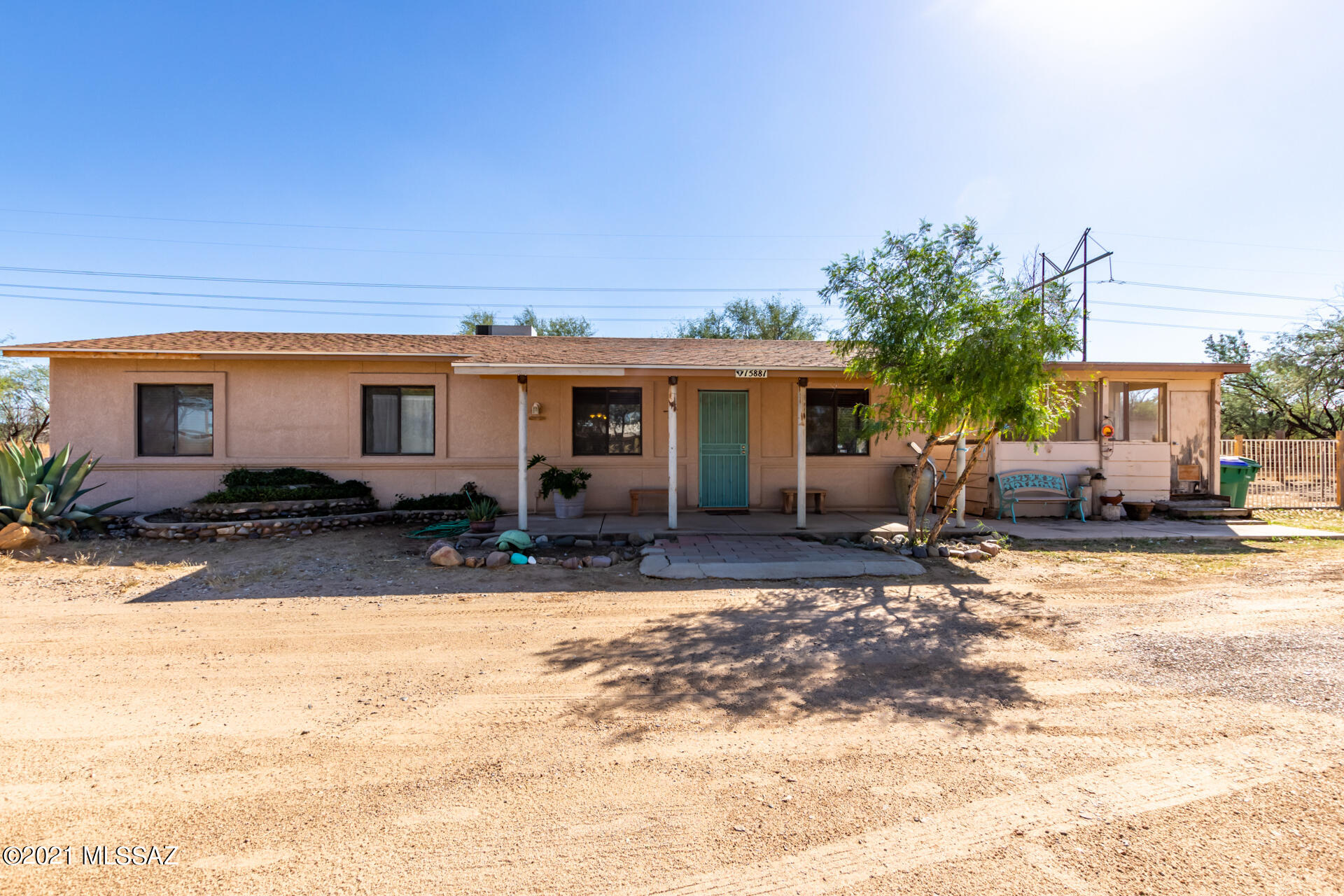 Don't miss out! 1 Acre horse property located next to Rancho Sahuarita in the Sahuarita Village Neighborhood. Minutes away from schools, shopping, walking paths, the historic Anza trail and Sahuarita Town Lake. This one of a kind property features a 1 bedroom 1 bath main house along with a guest house with bathroom, yard, and endless possibilities. The main house features a bonus room, roomy master suite, open floor plan with garden windows, a huge walled backyard with mature trees, plants and ready for your personal touch. Newer roof-2 yrs old; hot water heater replaced1 1/2 yrs ago.