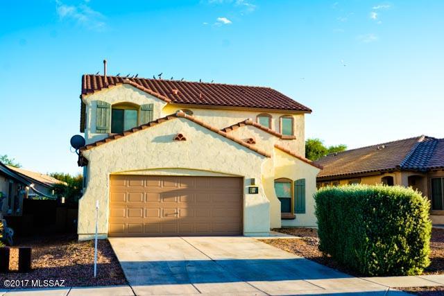 NEW PAINT - INSIDE & OUTSIDE!  A Pulte built 4 bedroom, 2.5 bath home with plenty of upgrades in a beautiful neighborhood!  Kitchen offers an island, large pantry, upgraded cabinets!  All bedrooms have walk-in closets! Close to parks and includes all of Rancho Sahuarita amenties!