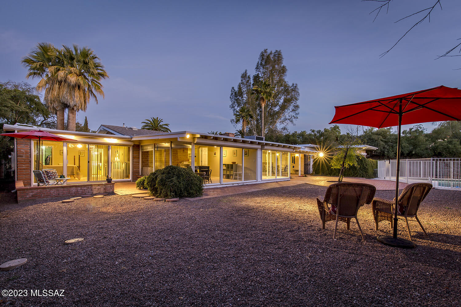 Nestled among beautiful homes and palm tree-lined streets awaits a gorgeous, Mid-Century Modern home w/well integrated indoor/outdoor space in historic El Encanto. This 3,225 sqft., 4br/4ba has great natural light &
skylights throughout and sits in the heart
of El Encanto. Open floorplan w/spacious rooms;  primary suite w/his & her baths; another suite split from the other Brs.; newer kitchen; rolling shutters throughout;  abundant built-ins & storage. Glass sliding doors look out onto inviting pool and yard. Deep shade porches in front & back. Outdoor workshop, sunshades and shower. Great opportunity to live in El Encanto. Sam Hughes Elementary School.  Close to restaurants, movies, parks, golf, tennis, zoo, baseball park, U of A and its' 3rd St. bike path.   20 mins. to the airport.