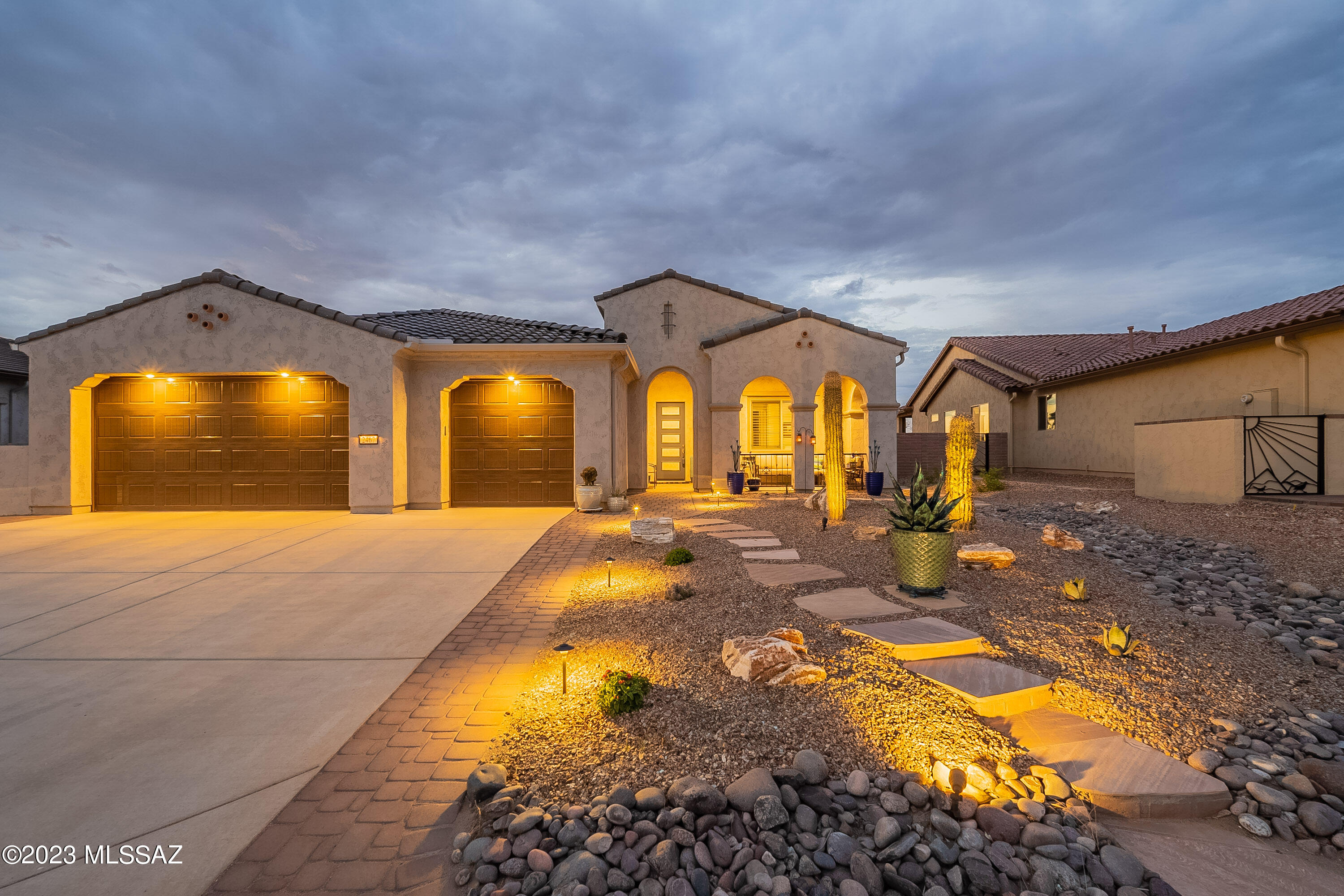 STUNNING ONE-YEAR-OLD AVALON w/GORGEOUS WALLED/GATED BACKYARD. FULLY COVERED EXTENDED PATIO W/FIREPLACE, 6 ELECTRONIC SCREENS, PORCELAIN TILE, and MOUNTAIN AND DESERT VIEWS!  Over $300,000 in options and upgrades, 2811 sqft with everything new! Quartz c/tops in kitchen & baths, 5 burner gas stove, huge walk-in pantry and butler's pantry.  Whole house water purifying and air filtration systems.  E-glass dual pane windows.  Primary bed/bath suite w/large walk-in shower and closet.  Extended den/office. Guest bed/bath suite w/walk-in closet.  Plantation shutters and Hunter Douglas shades.  LARGE 4' EXTENDED THREE CAR GARAGE w/epoxy floor and 2 fans. Replicate this house & spend at least $150k more and wait ten months.  Move-in now & enjoy Quail Creek resort living in this fun, active unit.