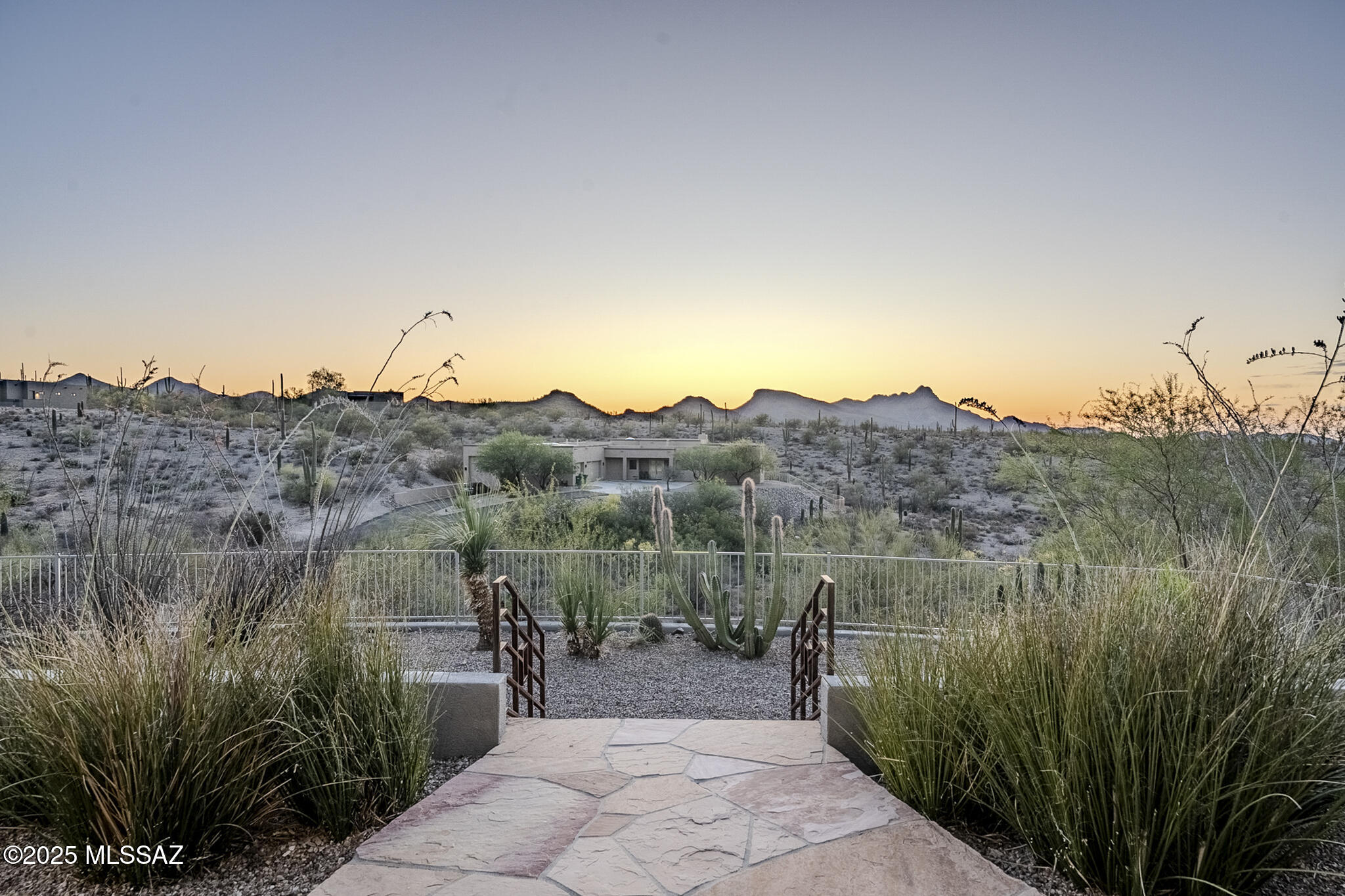 Embrace a serene, elegant lifestyle in this custom-designed Tucson haven, ideally positioned against the captivating backdrop of Saguaro National Park West. This stunning property offers privacy, unmatched panoramic vistas, and a living space tailored for the discerning buyer, featuring a generous 2,845 square feet of living space, that includes 4 spacious bedrooms and 3 full baths, with two of them being en-suites. An open and inviting floor plan merges light and space, creating an airy, vibrant atmosphere perfect for entertaining or serene relaxation. The house is fitted with large tiles in all main areas, enhancing the sleek, modern aesthetic.  Outdoor lovers will revel in the low-irrigation, tiered backyard with view fencing that provides an illusion of endless nature.  Beautifully finished with high ceilings & light paint which complement its modern, sophisticated aesthetic. Outdoor lovers will revel in the low-irrigation, tiered backyard with view fencing that provides an illusion of endless nature. Enjoy your morning coffee in the adorable courtyard or unwind from the day under the full length back patio with bonus retractable sunshades. Sustainability meets luxury with a state-of-the-art, fully owned solar system and on-site storage battery  say goodbye to large electric bills! Location is key, and this home is conveniently located just minutes from Silverbell, I-10, downtown, shopping areas, the Loop and parks.   Live on the edge of untamed landscapes without the fuss of road maintenance, as this ungated coveted spot in the Tucson Mountain Reserve ensures peace of mind.  Embrace the lifestyle you deserve, where nature's beauty meets eco-conscious sophistication. This house includes a substantial three-car garage and a thoughtful layout with a secluded primary bedroom retreat. This property is a perfect blend of luxury and practicality, a true sanctuary for those looking to enjoy an easy living lifestyle.