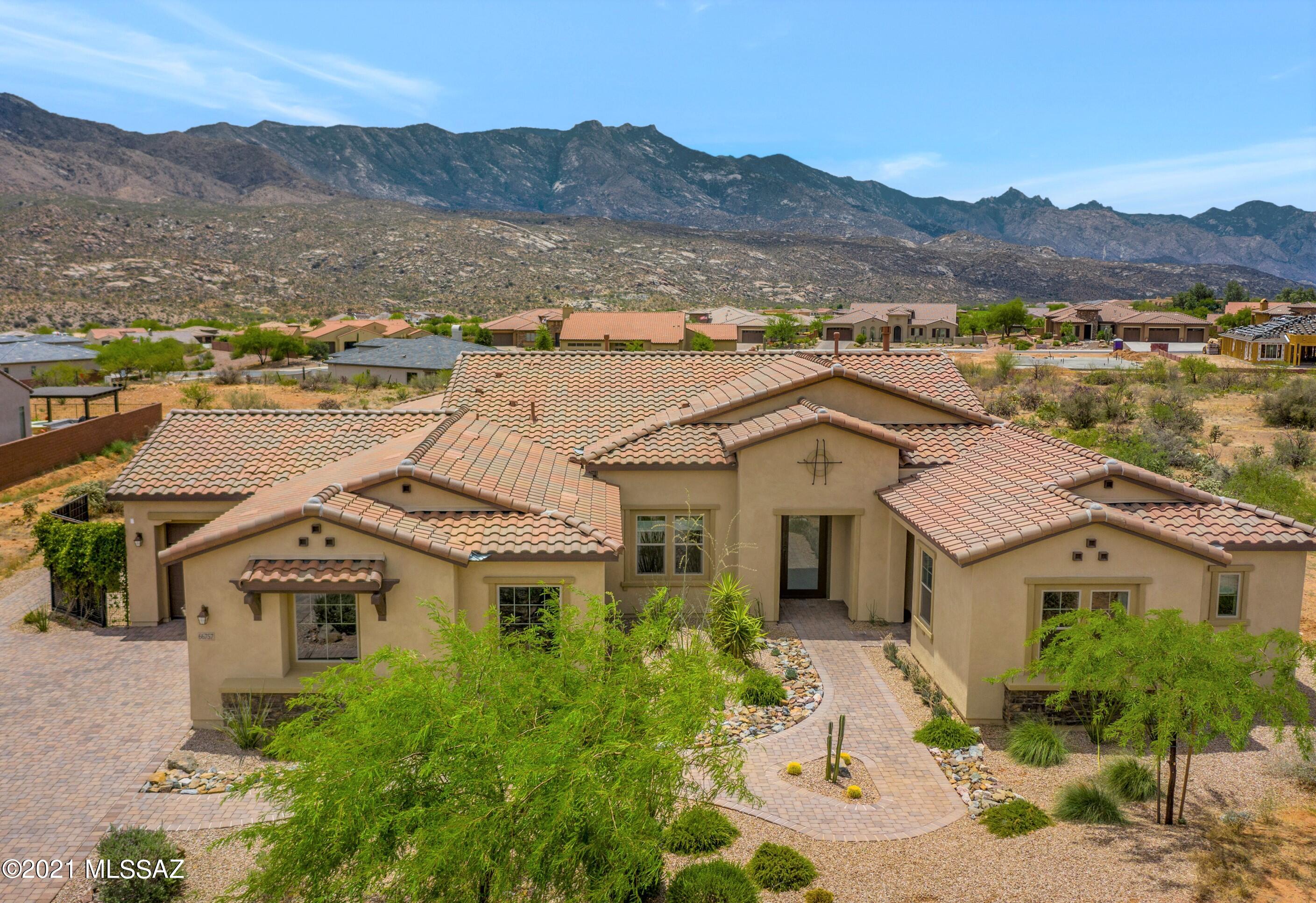 2017 Pulte Builder's Model Home is Highly Upgraded with 12 ft. & 10 ft. ceilings. This ''Bell Tower'' Floor Plan has Guest House, Mountain Views & 1.25 Acre Lot with space for you and your family. Great room with engineered wood floors, gas fireplace, & large sliders. Gourmet Kitchen with black stainless appliances, gas cooktop, 2 ovens, quartz counters & large island open to Dining area with mountain views. Owner's suite with bathroom & walk-in closet. 2 guest bedrooms & bathroom. Bonus room with built-in fridge. Guest House with living room, bedroom & bathroom. Extended 3 car garage with epoxy floors. Covered paver patio & extended patio with mountain views. SaddleBrooke's Preserve Golf Course & restaurants are near by for your enjoyment! Powder Room. Laundry Room with 2020 Washer/Dryer & Refrigerator. Owner's shower has custom glass & rain shower. Wrought iron fence & gated yard. Paver driveway, front entry pathway & back patio. Surround sound speakers, wifi repeaters & alarm system. Tankless water heater, kitchen R.O., whole home water softener, fire sprinklers, & smart panel. Gated Community. Panoramic Mountain Views!