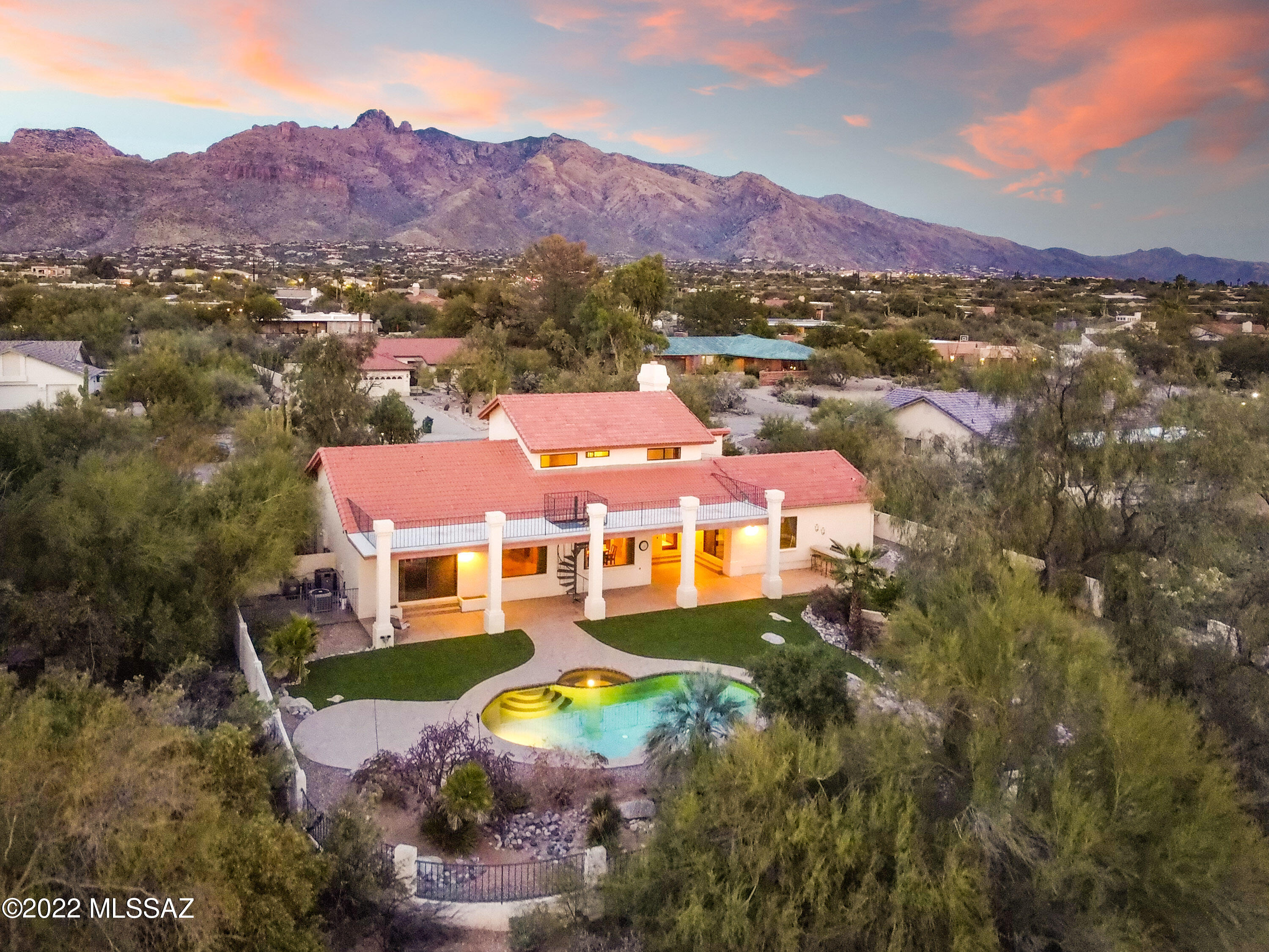 STUNNING foothills dream in a PRIME location with views! Experience soaring ceilings as you enter this elegantly updated home. Old world charm is infused into the gourmet kitchen boasting tons of storage, high end appliances and a custom floor to ceiling stacked stone fireplace. There is a guest suite with full bath and access to the patio as well as a private master bedroom wing on the first floor. For those needing their own space, there is a family room with an adjoining office/5th bedroom/flex space to provide options to spread out! Upstairs you will find a loft with 2 bedrooms and full bath. Outside is designed for carefree living with heated pool, spa, viewing deck and more. District 16 schools and world class shopping, restaurants and more make this the perfect place to call home!