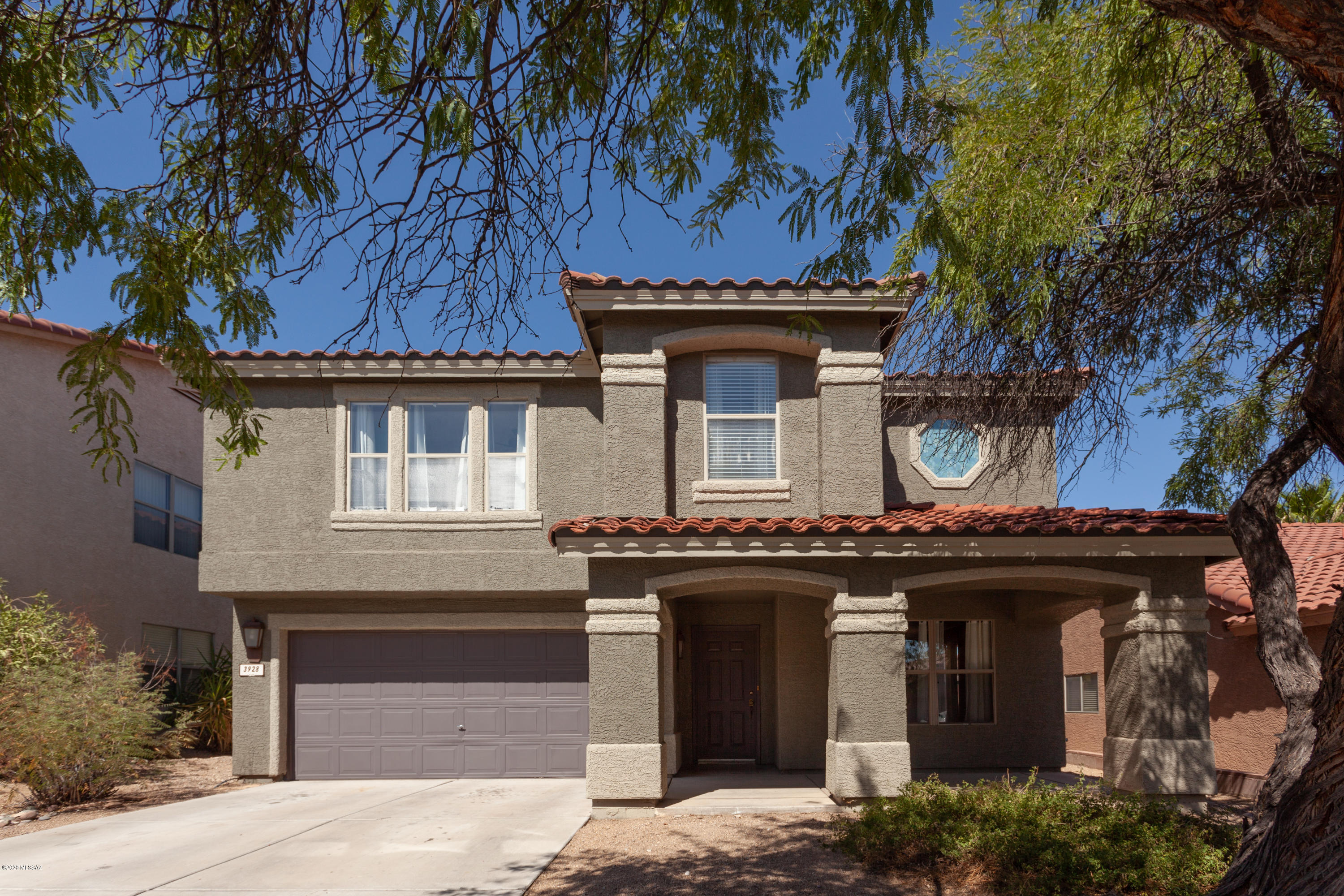 Beautiful, well-loved 4 bedroom, 3 bath home sits in the middle of a quiet street in a gated community. Enjoy covered patios in both the front and back yards or relax in the shade from the mature trees. NO CARPET anywhere in this lovely home. Kitchen and bathrooms have been updated with granite countertops; the kitchen has stainless steel appliances, all of which stay with the home! Bring as many kitchen gadgets as you can because you'll have a giant walk-in pantry! Laundry room (W/D incl) is conveniently located between the 2-car garage and the kitchen. Family room can double as a grand dining room w/space for your hutch or cabinets. Tired from a long day? Relax on your master balcony or take a soak in the tub. Large loft upstairs is another great living space. Home warranty included!