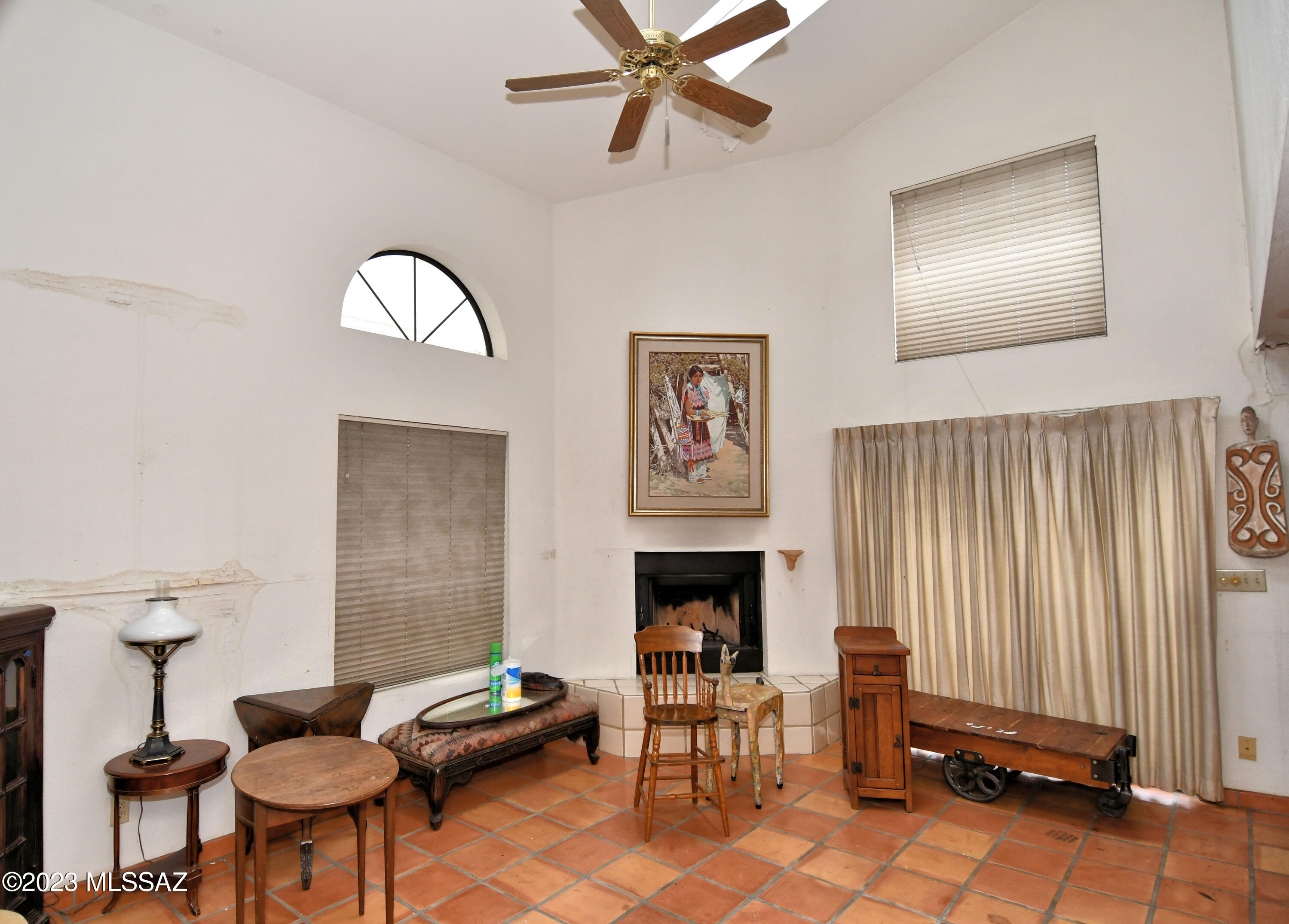 FIX UP Contemporary Patio Home is part of a 15 home enclave Located in the Heart of Downtown Tucson! It's hidden from the hustle & bustle within the historic Presidio neighborhood. Walk or bike to government offices, shops, restaurants. Enjoy nightlife & the trolly! Great Room Living Vaulted a full 2 stories with a turned staircase! Huge windows. Walled lot is gated to the street with yard space wrapping around the home. Roof Deck over the garage is a fantastic elevated outdoor space!  A grand home under same ownership since 1993 is in need of restoration/remodel. Offered as-is by the estate.