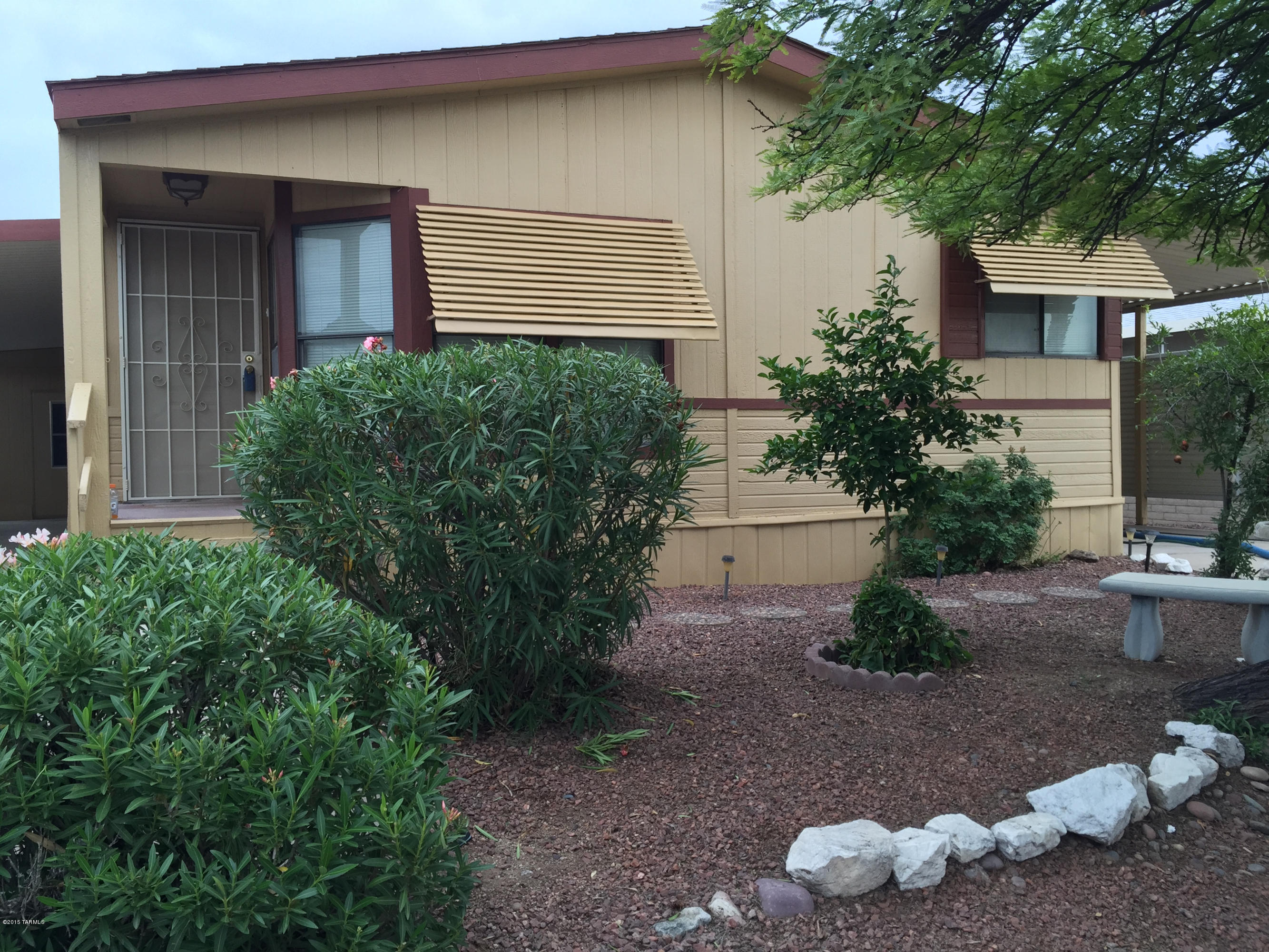 Well maintained 2 bedroom 2 bath manufactured home in a quiet and beautiful subdivision. 55+ Community with pool, spa and many more activities. HOA pays for water, trash and sewer. Home includes a freshly painted interior and enclosed Az. room. Beautiful b-fast nook area. Kitchen has plenty of cabinet space. Built in hutch in dining room. Separate laundry room that is very spacious and has plenty of storage. Double oven and stove included. Two carports and a corner lot. Perfect as a primary, secondary or vacation home. AC/Heating wall unit in Arizona room sold as is.