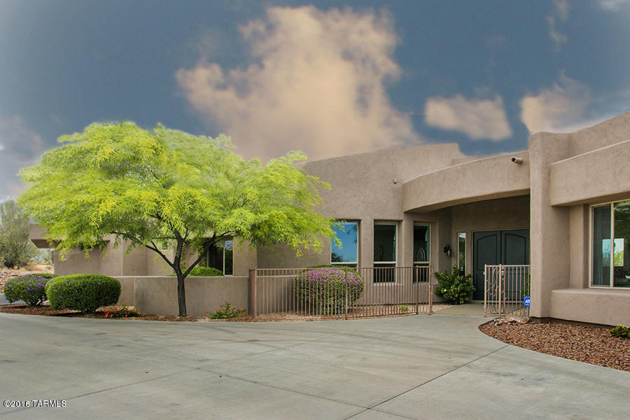 Sellers will accept or counter offers between $774,900-$799,000. CLICK ON 3D TOUR TO WALK THRU THIS HOME! Absolutely stunning Soloway designed custom home with amazing Pusch Ridge views! This is a well thought out, perfect floor plan. Great room w travertine & wood floors, open granite kitchen, stainless steel appliances, Advantium double oven, huge pantry. Bar off great room has wine fridge. Perfect for entertaining! Master suite has access to backyard. Master bath has his/hers vanities, walk in closets, & even water closets for convenience! Split plan offers secondary bedrooms on separate wing of home. Each bedroom has walk in closets & their own full bath to make life easier for families.  Backyard is the place to be entertaining guests. Swim and soak while taking in the amazing view!