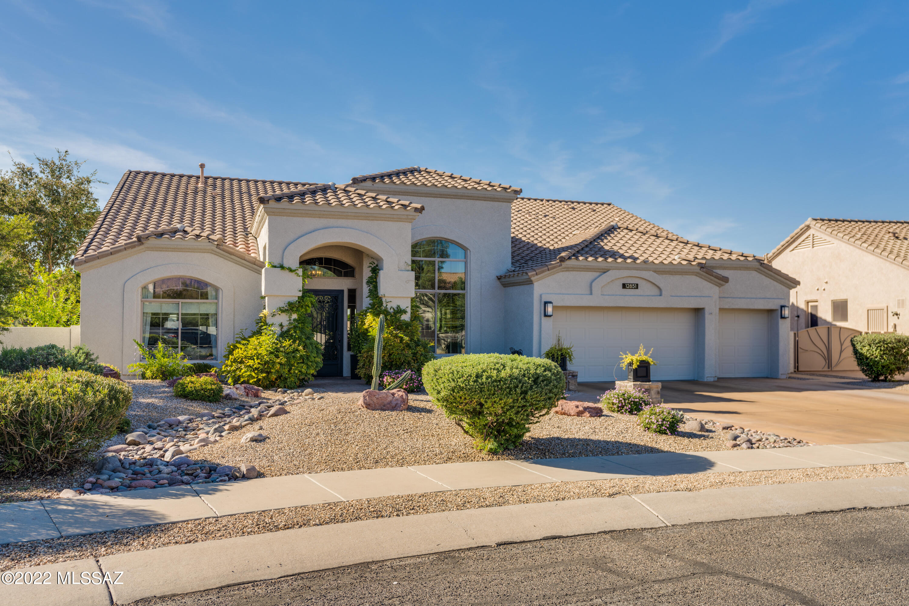 Beautiful Oro Valley 4bd 3 ba on a private cul de sac lot. This home has been completely updated inside and out and features soaring ceilings, large windows that frame our amazing desert landscape, designer details throughout.  Extended back patio makes a great space for entertaining. Jump into your heated sparkling pool or spa. Enjoy your outdoor fireplace on  those cool AZ nights while listening to the sound of water trickle in the fountain.  Beautiful roses and citrus trees are part of this amazing backyard space.  This lot backs to open desert space and captures views of the Tortolitas.
