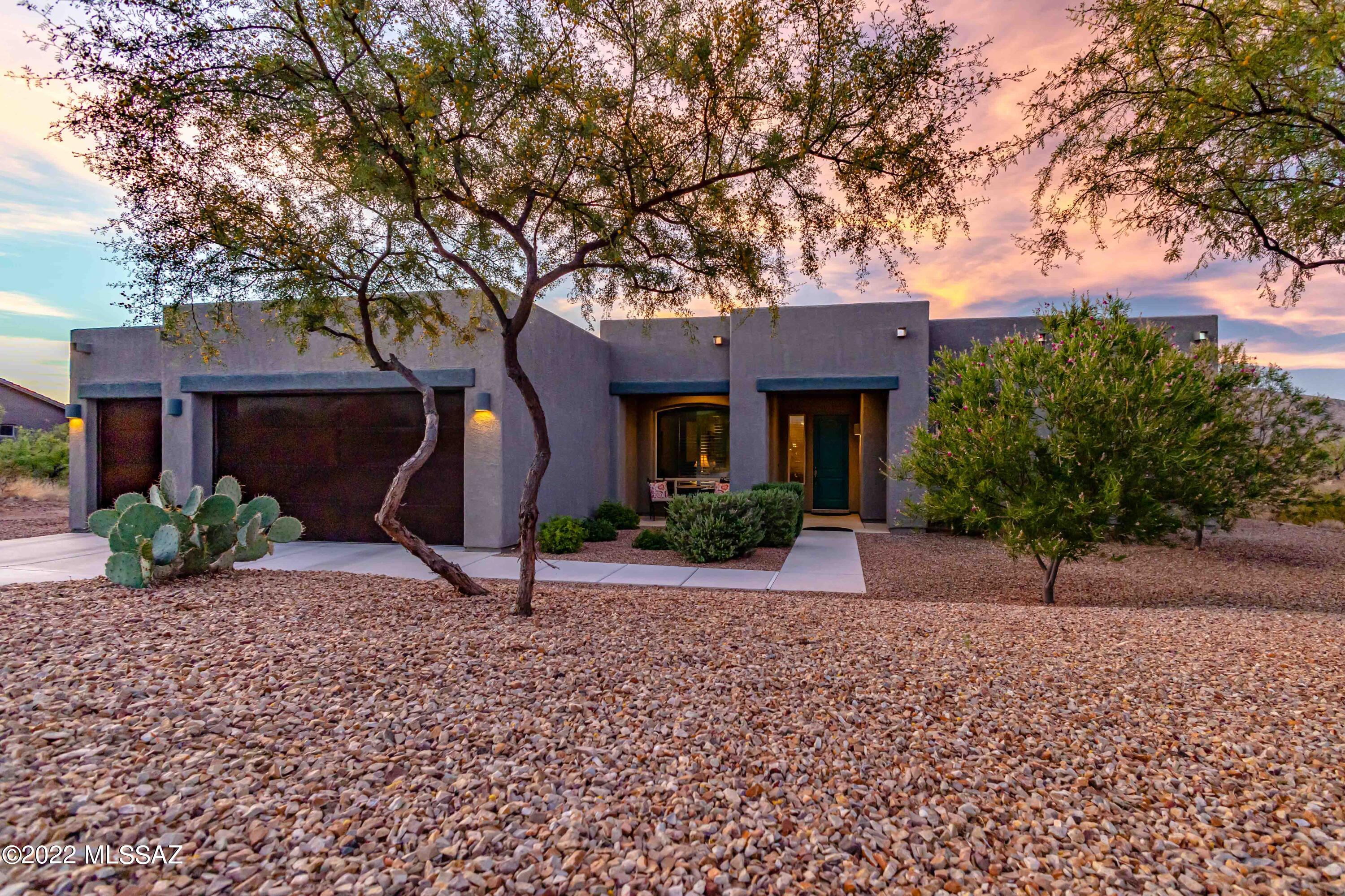As you step into this masterpiece, you will be taken aback by the quality and spaciousness of this beautiful, better than new, semi custom home. Interior  Designer touches throughout. 8' Knotty Alder entry door opens into the Foyer, this impeccable home offers a panoramic view of Saguaro National Park E. Expansive Great Room flows into the Gourmet Kitchen that boasts a massive island, Alder upgraded cabinets w/crown moldings, Recycle drawer, under counter lighting, drawers w/full extension & a soft close feature, 3 cm Natural Stone Granite countertops, 5 burner 36'' Thermador gas cooktop, 30'' Convection oven & Bosch 800 Series Dishwasher. Mountain views surround you from all sides. Luxury Owners Suite has motorized Hunter Douglas blinds showcasing Rincon Mountains. 4' Extension in garage.