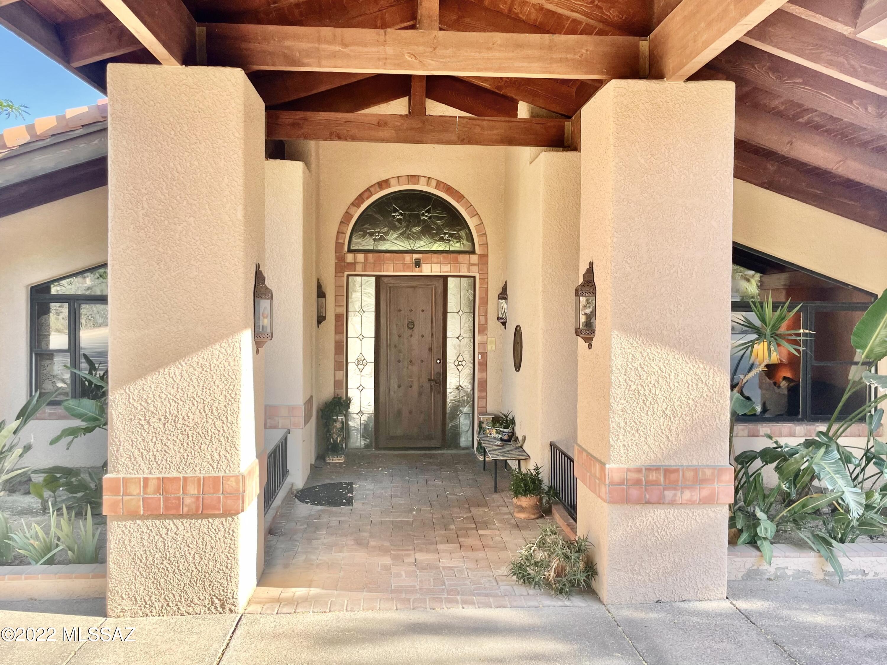 Classic Ventana Canyon, One Owner, Custom Home on The Golf Course w/ City and Mountain Views. This All One Level 3 Bedroom & 4 Bathroom w/ Office Home Is Anchored By A Central Wood Beamed Cathedral Ceiling That Runs From The Front Driveway Portico Through the Home To The Back Patio - Covering the Main Living Areas, Kitchen/Dining/Great Room, And Balanced By a Split Floor Plan of The Spacious Primary Suite on One Side and The Guest Suites & Office on The Other. Original Finishes Throughout, This Home Offers a Fantastic Remodel Opportunity in The Coveted Ventana Canyon Community.