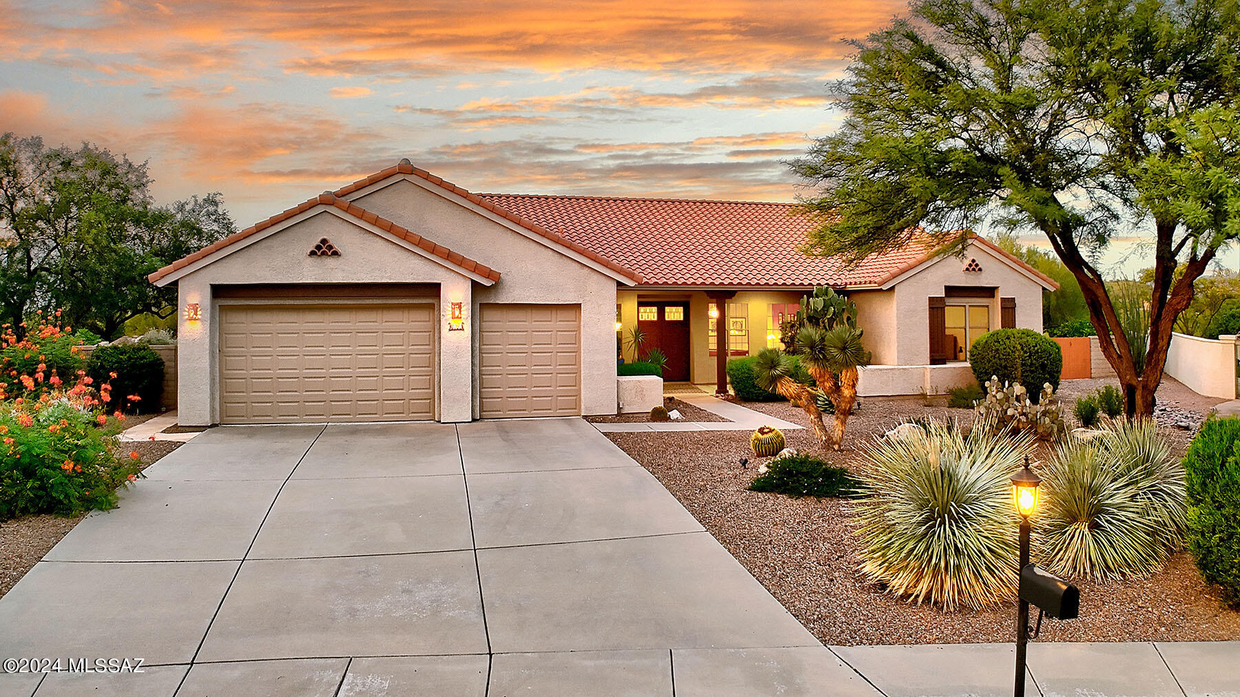 Stunning soft contemporary on a sensational 1/2 acre homesite in the desirable Monument Vista subdivision overlooking magnificent mountain views. Foyer entry, living room & formal dining room, high ceilings, light & open island kitchen w/granite countertops, double ovens, gas stove top, refrigerator, freezer, pantry, lovely breakfast area opens to family room w/ fireplace & art niches, beautiful tile floors (no carpet), 4 bedrooms + study or 5 bedroom (split plan), 3.5 baths, primary bedroom w/sitting area, luxurious bath w/double sinks, garden tub, separate shower, large walk in closet, private entry to rear patio, laundry room & 3 car garage. Fabulous backyard w/covered patio, flagstone, heated pool, spa, fireplace, lush landscaping, 4 citrus trees, breathtaking mountain views!
