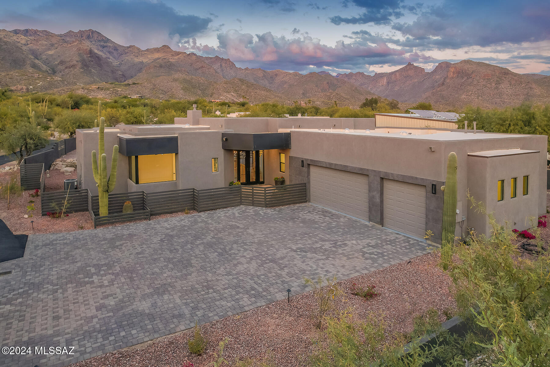 Exquisite NEW southwest contemporary designed by Greg Simmons & crafted by Al LeCocq. The private 1.2 acre lot is within walking distance to Sabino Canyon, schools and offers STUNNING mountain views! Magnificent home for discerning buyers who understand quality in workmanship. Spacious open great room floor plan w/soaring ceilings, floor to ceiling windows, 8' solid doors and gorgeous tile throughout. Gourmet island kitchen with beautiful high end cabinetry by Affinity Kitchens, top of the line SS appliances, built-in refrigerator, Quartz counters and large walk-in pantry. Spacious primary suite and 4 luxurious bathrooms. Enjoy the great outdoors in the north facing rear yard with the expansive covered patios, built-in BBQ and STUNNING views! Must see More Section, 3D Scan and Floor Plan. Please use Agave Title, Kelly Ladrido Escrow Officer. 520-918-1683. Kellyl@agavetitle.com. Title Commitment with legal description and links to CCR's are in attached documents.

Al LeCocq was SAHBA's Custom Home Builder of the Year award winner 2 times. LeCocq Custom Homes are built with engineered post tension slabs, fully sheathed plywood exterior walls, R-38 insulation in the ceilings, energy efficient windows and many other custom features.

There is no HOA however there are recorded gate and road maintenance agreements that currently total approx. $122 per month. 

This home features high-end contemporary cabinetry designed by Affinity Kitchens. These stunning cabinets are finished in a textured melamine, offering timeless beauty and incredible durability, and backed by a limited lifetime warranty. Built with soft-close, full-extension guides, they provide smooth, effortless operation and easy access to storage. With their classic, sophisticated design, these cabinets elevate the space, providing both elegance and functionality for years to come.