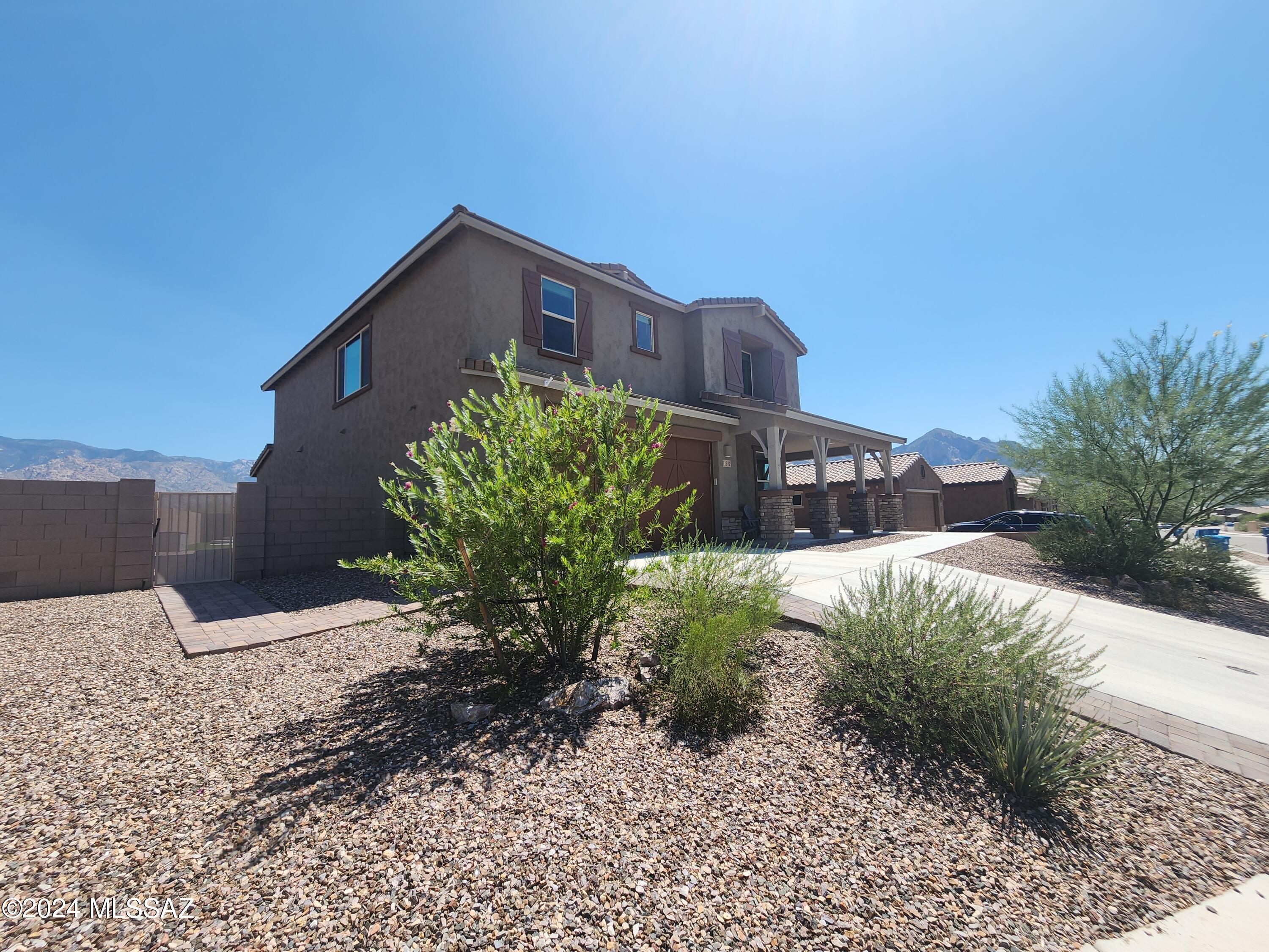 2021 Meritage home w/10'ceilings! 3475sf, 4BR/Den &  Bonus room (used as play area). Enjoy mountain views through-out the home & most definitely from the backyard! Enter into generous sized Greatroom concept home w/gourmet kitchen: gas cooktop, double ovens, breakfast bar island, coffee bar & beverage bar areas & dining area which is divided by a split access staircase w/den & powder room on other side. Upstairs has sizeable loft w/access to 4 BR. One guest room has an ensuite. Primary has amazing views of mountains, spa-like ensuite & walk-in closet. All BR will exceed your expectations on their size & walk-in closets! Room for vehicles & toys in tandem 3 car garage w/10' ceilings! E facing backyd for sunrise views & shaded for swims in the pool! Gas stub off patio