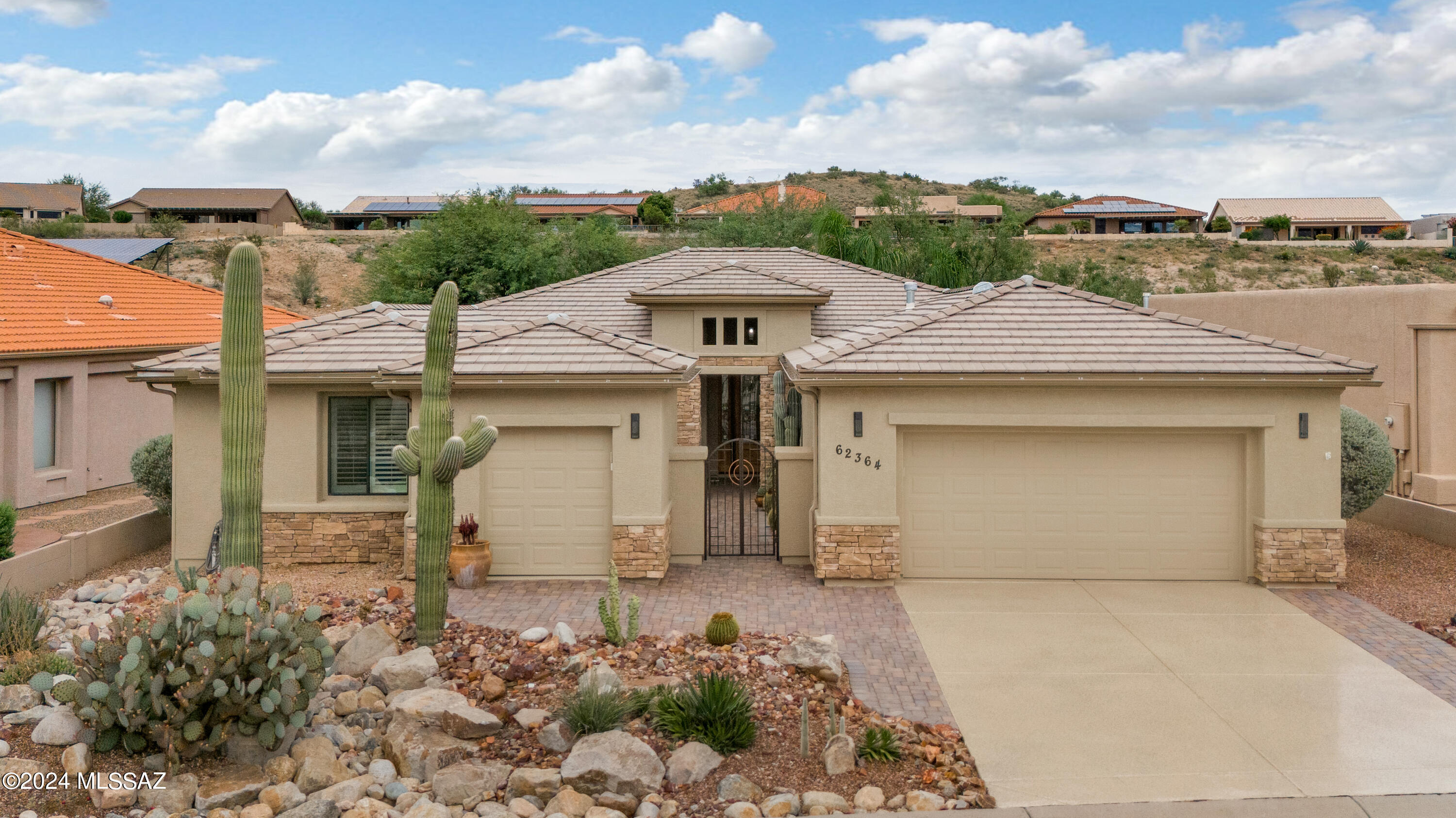 This Exquisite Cimarron with Guest House has been completely rebuilt from the studs & every inch recently remodeled. Private Paver Courtyard! Open Concept Living. Great Room has Electric Fireplace & French Doors to Patio. Gorgeous Kitchen has Stainless Steel Appliances, Gas Cooktop, Granite Counters, Island, Wine Cooler & Cherry Cabinetry. Owner's Suite with French Doors to Patio. Owner's Bathroom designed with high-end finishes, Walk-in Shower & Organized Walk-in Closet. Den has Built-in's & Murphy Bed. Guest Bedroom has Walk-in Closet & Guest Bathroom near by. Guest House with Bathroom. Laundry Room has Washer/Dryer. 4 Solar Tubes & Tile Floors Thru-out. Extended 2 Car Garage has Sink & separate Golf Cart Garage. Covered Patio with BBQ Station with Sink & beautiful Landscaping to enjoy!