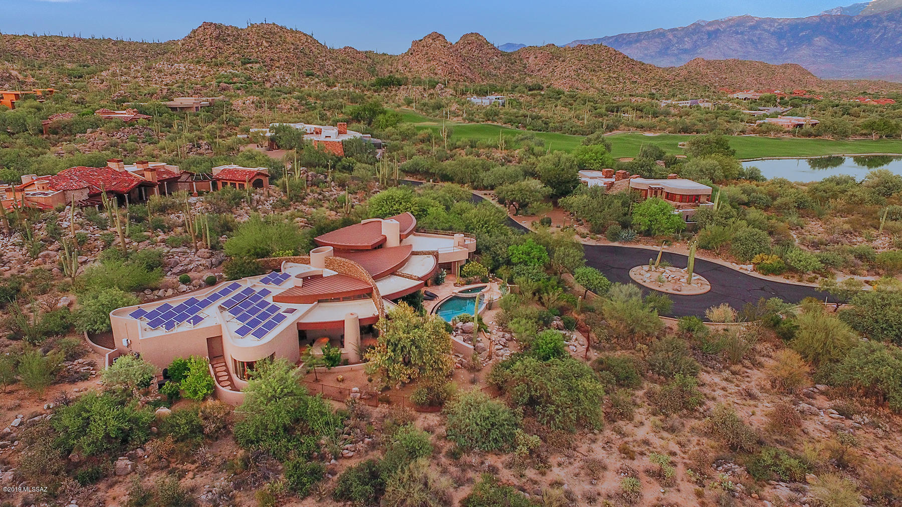 Dramatic & timeless contemporary, designed by renowned Southern AZ architect, Kevin B. Howard, is an enchanting property sited on private lot in the prestigious gated community of Stone Canyon. Custom stacked stone walls lead you from circular motor court to foyer into unparalleled architectural design. Spacious den w/loft retreat showcases incredible panoramic views of the Catalina Mtns, rock formations, golf course & stunning city views. Natural light floods every room w/massive windows taking advantage of the natural desertscape. Spectacular angular pool/spa mirroring the contemporary design of home w/misting system, outdoor kitchen w/FP & private seating areas creates the perfect ambiance to entertain. Other amenities include casita, gourmet kitchen, wet bar w/wine storage & solar.
