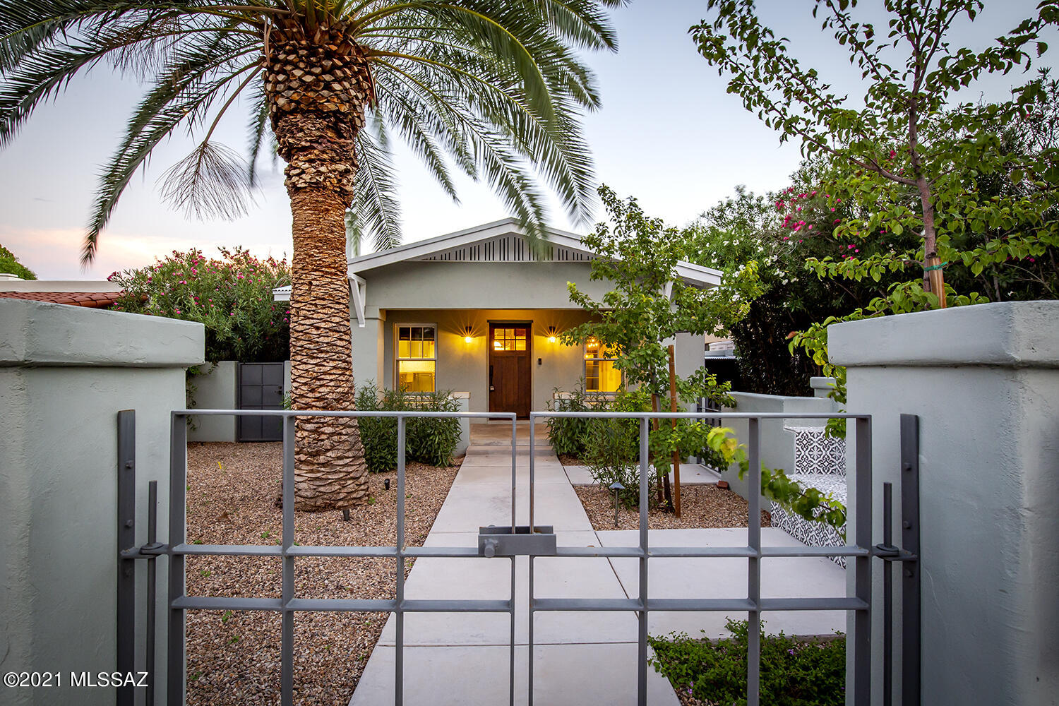 Sam Hughes, 3 Br/2 1/2 Bath, main house totally remodeled & expanded in 2018 with separate 2 car garage & guest house above. Stunning, highest quality remodel from flooring, cabinets, counter tops, appliances, heating/cooling. Guest house over separate standing 2 car garage has a covered patio w/mountain views (rare for central Tucson). Side yard covered patio has a built in kitchen (great for relaxing & entertaining). Great location (3 blks to the UofA, 1 blk to bike path, short walk to Downtown Trolley, 1/2 mile to Medical Center). Potentially qualifies for historic real estate tax reduction. See floor plan.