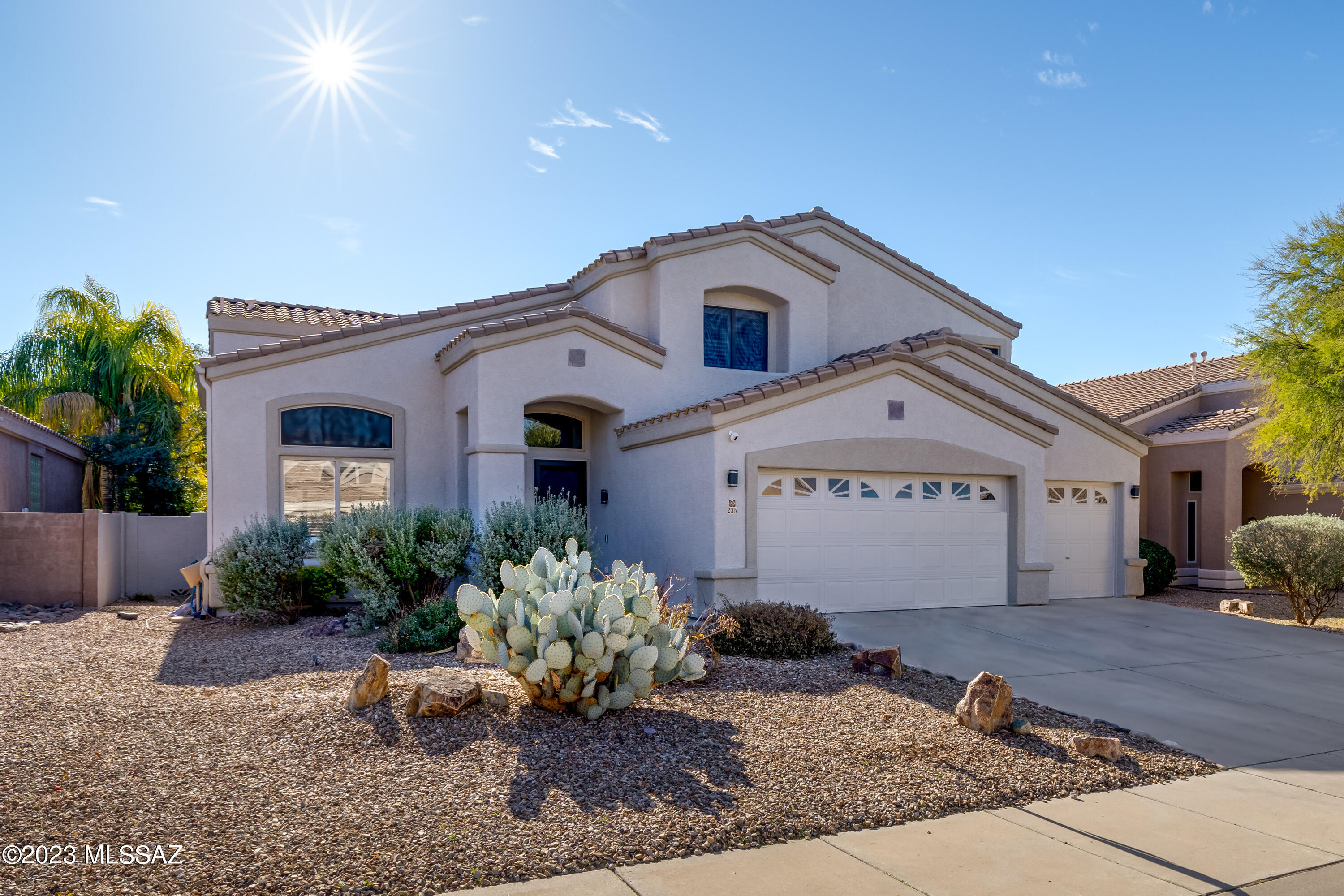 Beautifully updated 4 bedroom, 2-1/2 bath, den, pool and 3 car garage in Rancho Vistoso. Stunning Entry way with wood floors, living area, formal dining room, open family room with fireplace off the upgraded Kitchen. Gourmet Kitchen has granite countertops, tile backsplash, stainless steel appliances, island and casual dining area. Large Master Bedroom with remodeled Master Bathroom with separate tub and shower, dual vanity, walk-in shower. Remodeled Family Bathroom with oversized shower. Gorgeous backyard with extended cover patio with remote control screens around entire patio, sparkling pool and synthetic grass area with beautiful palm trees. Please see extensive upgrade list under documents.