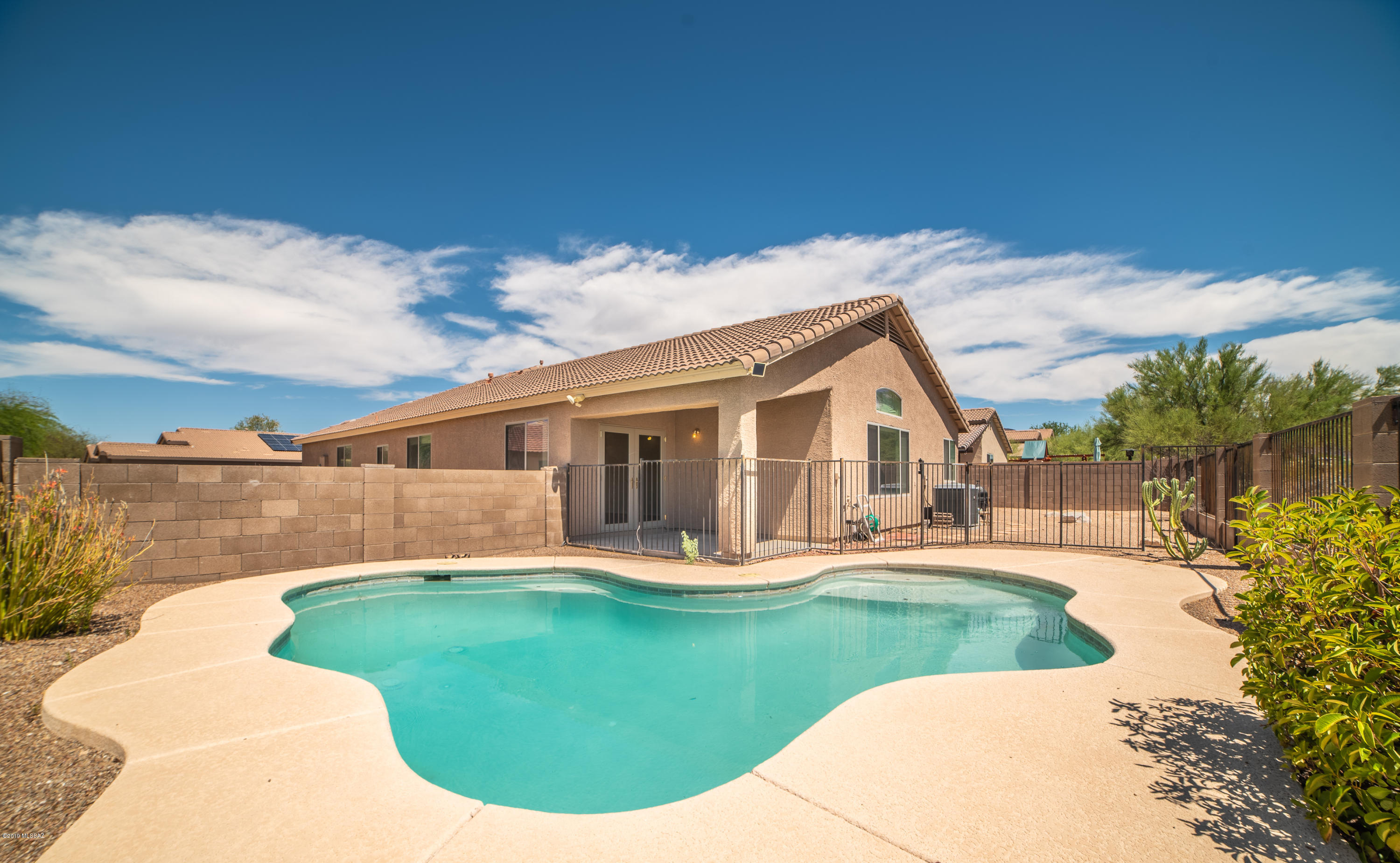 Diamond in the Desert!!!!
REFRESHING POOL in a very private back yard, with open desert space behind. SINGLE story, 1,873 sq ft. 4 bd 2 ba open floor plan. Granite countertops, ss appliances, upgraded lighting, vaulted ceilings. This home has been well maintained, and is move in ready.  New carpet and fresh paint throughout. Soft water and RO system. Prewired for SS.  Come see this lovely home in Tucson Mountain Sanctuary.