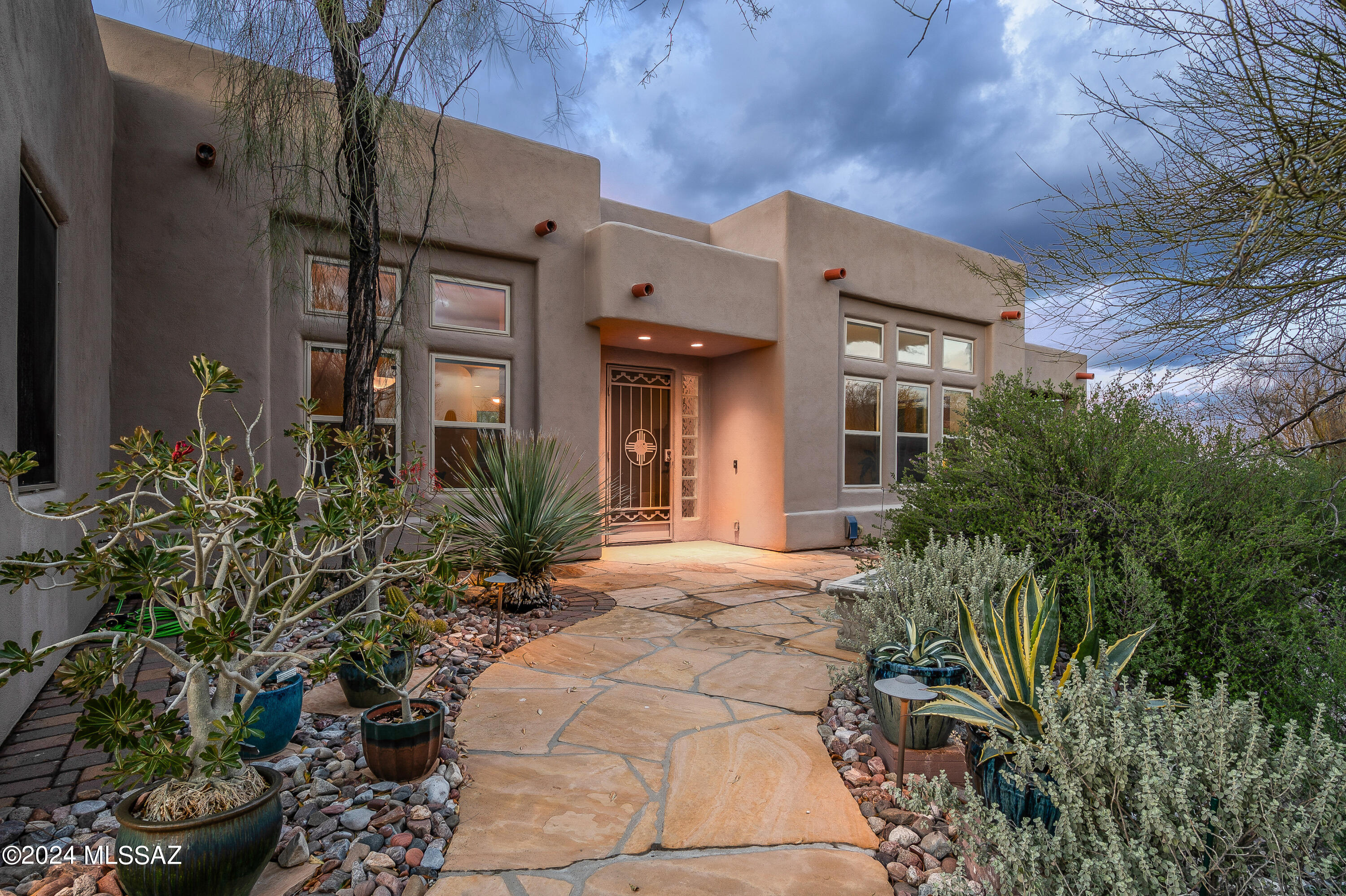 Welcome to Snyder Canyon Estates, a lovely 20 home community where pride of ownership shines on every lot. This spacious 3 bedroom (with office/hobby room) is on the north side of the street allowing for spectacular backyard views of the Catalina Mountains. Enjoy this outside oasis poolside or by the outdoor fireplace beneath the covered patio. Wonderful mature desert shrubs and trees are joined by special plantings by the owner that makes the yard pop with color. Owner has counted 75 Saguaro cactus on property! You'll find no carpet in this home and the hand picked granite in the kitchen is just beautiful! Close to many amenities in the Tanque Verde/Sabino Canyon area. This Northeast home is special...don't miss out!