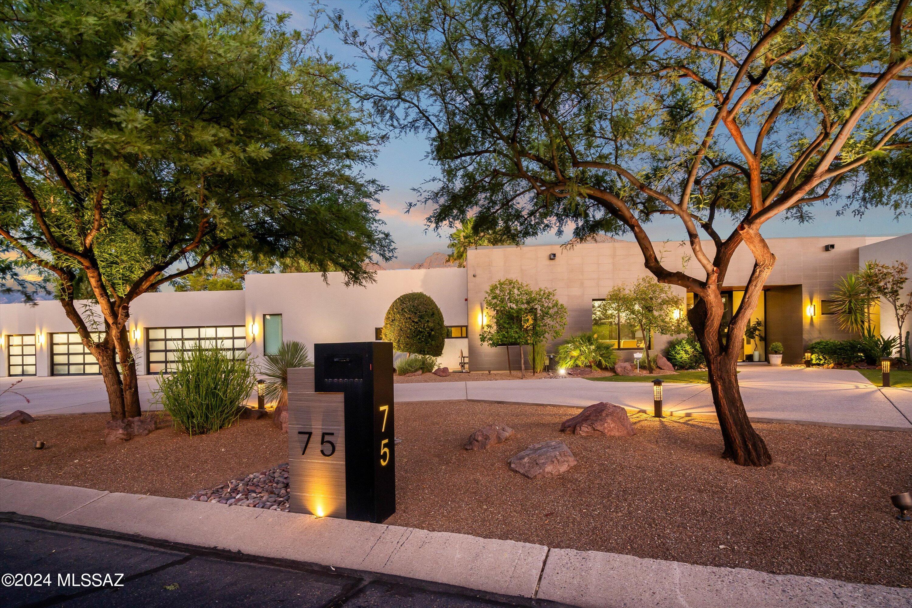 Modern perfection awaits at this award winning contemporary/modern Home 5 BR, 4 BA, 4,420 Sq Ft home in Oro Valley Country Club Estates. Breathtaking Mountain & Golf Course views provide the ultimate panoramic setting. Built in 2015 this home has a Gourmet kitchen with Wolf range and Sub Zero appliances and large walk-in pantry. Generous kitchen island backs to the Great Room highlighted by expansive views of the Pool, Mountains and Golf Course. Master suite provides more views, combined with 2 vanities, walk-in shower, and dual closets. 4 additional guest bedrooms, 2 with Jack & Jill bathroom. Activity room that can be used as playroom, hobby area , home school or flex space Huge Laundry room in an ideal split floor plan. The 5 car garage is over 1,200 Sq Ft and has additional storage + golf cart garage OR be setup for a true 5 car garage. Backyard pool, with built-in BBQ, artificial grass, fire pit and great covered patio.

Located in the heart of Oro Valley Country Club, this home provides incredible lifestyle. Access the golf club, tennis, dining, and other club amenities. It is a rare occasion a home of this quality is offered - don't miss your opportunity to own true modern luxury in the heart of Oro Valley.