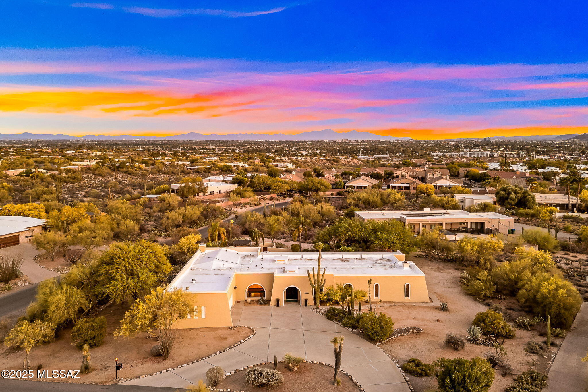 Catalina Foothills Home on private oasis lot with Mountain & City Views! The Expansive Circular Driveway brings you to a lovely double door entry & wide-open Floor Plan of this 5 BR, 3BA home attached Guest Quarters (with kitchen, bath & private entrance), huge Media/Theater Room. Upgrades include Travertine Floors, Large Kitchen w/ Cafe Appliances, Updated Baths, Luxe Primary Bath w/ large soaking Tub & separate Shower, High Ceilings & new paint throughout. Massive Covered Back Patio features several seating & eating areas, new high-end Ceiling Fans, Gas BBQ...truly spectacular yard w/Pebbletech Pool, New Ramada & Hot Tub, Fruit trees & Garden area, along with a 6 ft custom Cactus Fountain.  All this in a perfect Old Foothills Neighborhood!