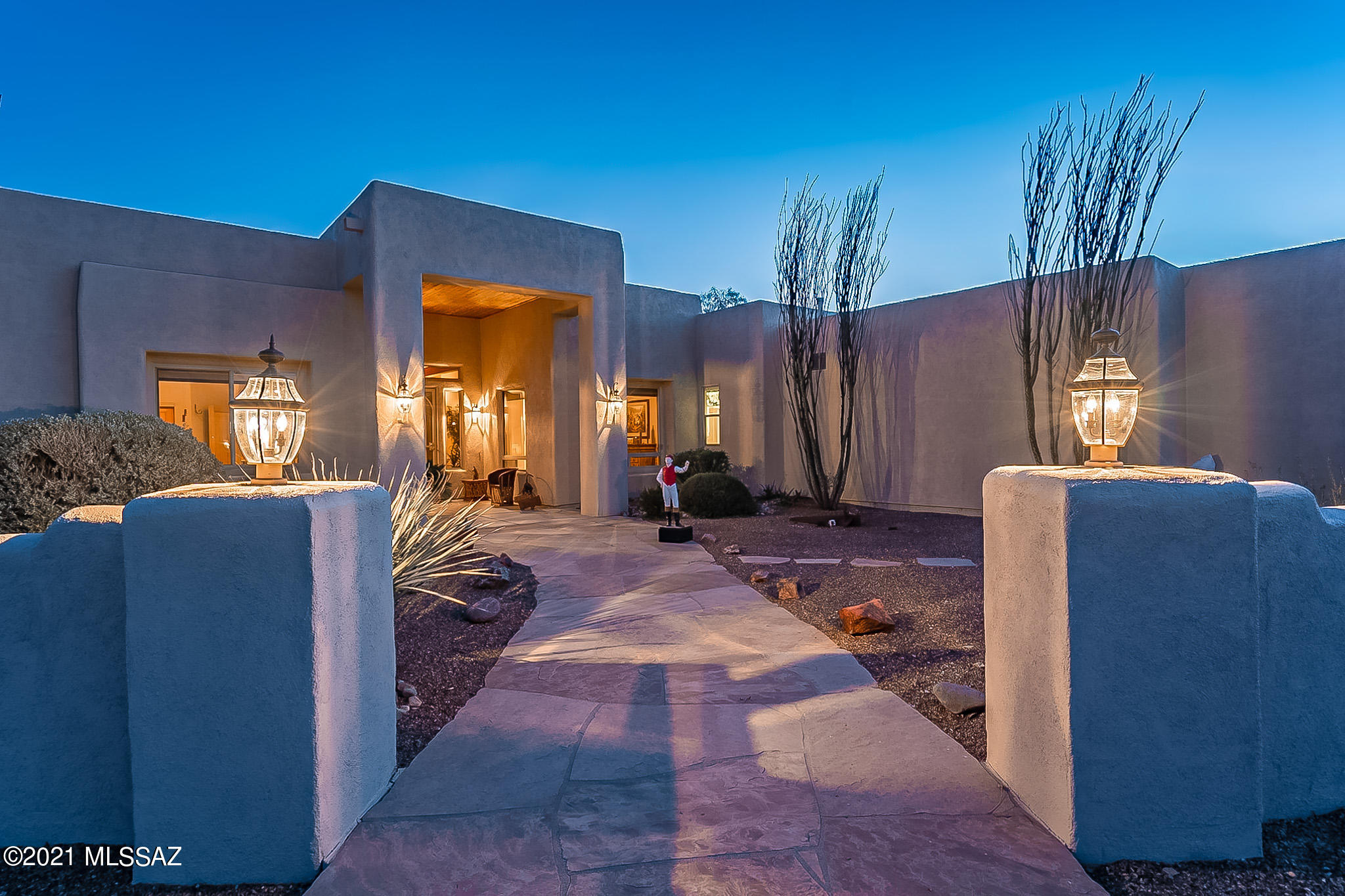 One parcel away from the Saguaro National Park!  Easy access to miles and miles of hiking/horseback riding and wildlife viewing!  The house was custom built to capture the incredible views of the Catalina and Rincon Mountains!  Gated entrance for privacy. Views everywhere!  Professionally landscaped with mature trees, fruit trees, Saguaro's, flowering shrubs, and interesting cacti.   Custom touches throughout - custom front door, dramatic entry, raised panel Alderwood interior doors, open beam ceiling with wood inlay and large picture windows that frame the views.  Great room with Beehive fireplace – open kitchen with large island.  High ceilings and natural light. Oversized 3 car garage.  Separate workshop.  Horse facilities include Mare Motel, 4 stalls, 2 tack rooms, round pen, wash ra and horse run.  Plenty of room for parking horse trailers, RV and guest's cars.  The walled backyard courtyard feels like a resort setting.  A wonderful house for entertaining.  Southwestern elegance.  No HOA!  3.99 acres.  Perimeter fenced. Listing Agent is related to the Sellers.