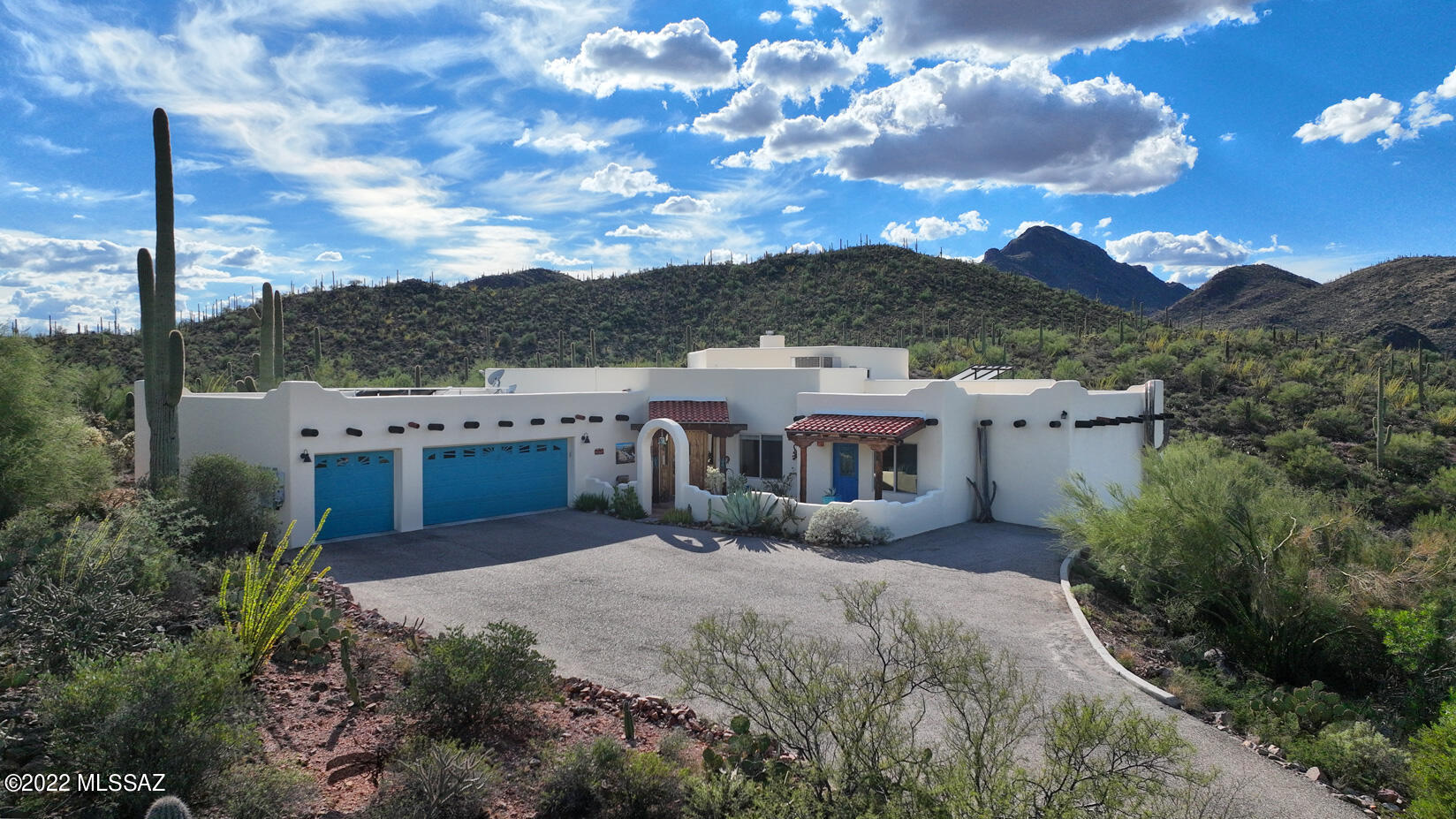 360 degree breathtaking views of mountains & city lights, quality Rastra construction & eco-friendly permaculture features, your desert oasis awaits! 3.5 acres nestled in the Tucson mtns & abutting Tucson Mtn park, this fabulous hm features sky-hi wood ceils, decorative talavera tile accents, solid wood drs & artistic touches thruout. Living rm offers a beehive fp, clerestory windows & wetbar w/copper sink. Kitchen features amazing cobalt blue appl, gas cktop, lg pantry, & concrete counters. Huge primary suite w/dual sinks, walk-in shower, lg walk-in closet & incredible copper tub. Enclosed bkyd has 2 cov'd patios, 1500 gal. cistern, garden beds, fruit trees, greenhouse & chicken coop. Owned solar, whole house water filtration, hot water recirculation, no HOA & just minutes from Downtown! Take in all the sonoran desert has to offer with several hiking trails right from your backyard through the protected Tucson Mountain park with lush desert vegetationincluding and abundance of gorgeous mature saguaros. For those looking for your private southwest haven, this truly is the one.