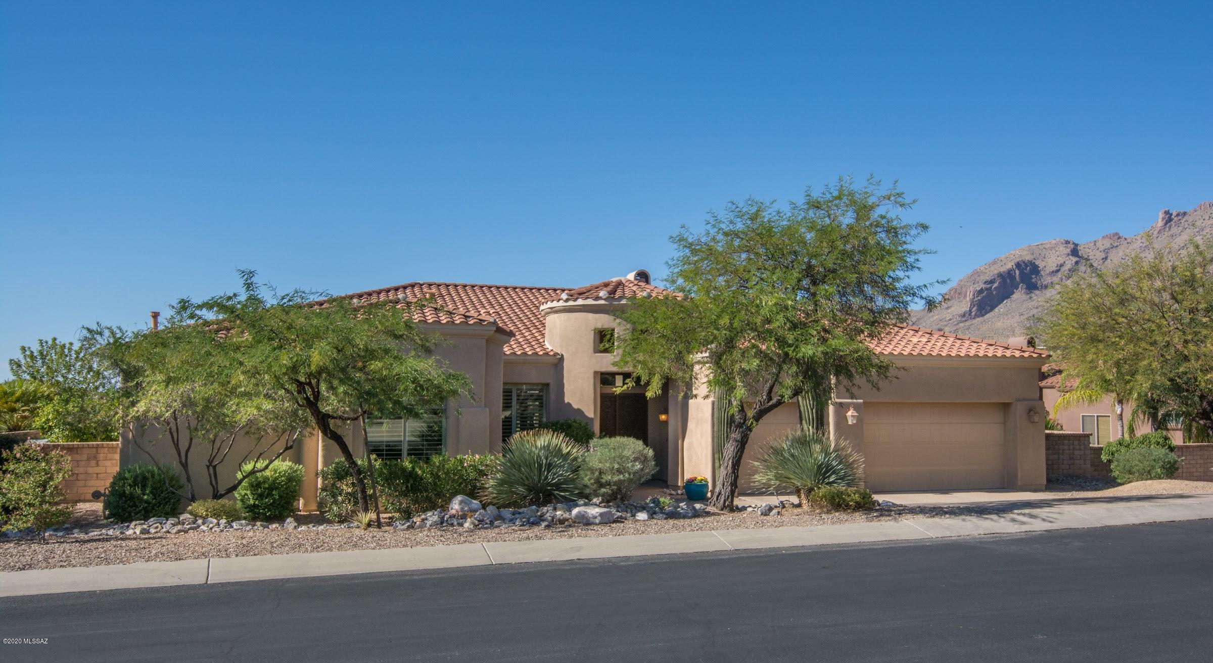 Fabulous resort-like backyard oasis and stunning mountain views await you at this gorgeous ridgetop home in sought after gated Pinnacle Ridge.  Outdoor living at its finest with wonderful pool, spa, waterfall, built-in BBQ, cozy firepit with seating area, lush landscaping and large covered patio...all situated on a prime lot that backs to common area and incredible greenbelt.  Inside, you'll fall in love with the spacious open greatroom featuring living area with fireplace, separate family rm & huge windows.  Awesome kitchen that's perfect for entertaining has gas cooktop, granite counters, handsome cabinetry plus a lovely breakfast area.  Huge Master Suite with more views, bay window, dual sinks, garden tub and walk-in shower. Very nice large format ceramic tile everywhere except bdrms.