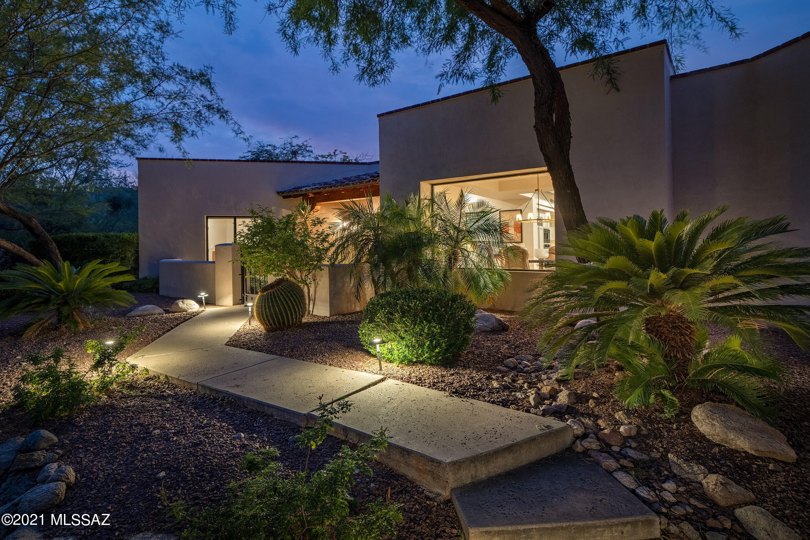 This perfectly executed Ron Robinette designed and Mark Alan built home incorporates a masterful blend of textures, elegant finishes and stylish details. Located in the highly sought after gated community of Ventana Ridge and situated on an elevated private homesite, with walls of glass stretching out into the natural view corridors. The open floor plan offers effortless flow from room to room, with a dedicated owner's-wing and 3 additional suites, creating the perfect balance for both winter visitors, or full time residents alike. The interior features an open concept plan, with a top-end gourmet kitchen, complete with Decor stainless steel appliances, Sub Zero refrigerator and Bosch dishwasher, modish colored cabinetry, with stainless pulls, contrasting against soft granite countertops. Comprised of four bedrooms and three baths, which includes the owner's suite, featuring a large walk-in closet, luxurious master bathroom, with modern designer fit and finish. Enveloping the residence are a number of outdoor living spaces, each of which has been thoughtfully positioned to procure the utmost enjoyment looking out over view corridors and tranquil surroundings. Fostering an indoor-outdoor lifestyle, takes full advantage of proximity to Sabino Canyon, Canyon Ranch, essential goods and services, as well as fine and casual dining.