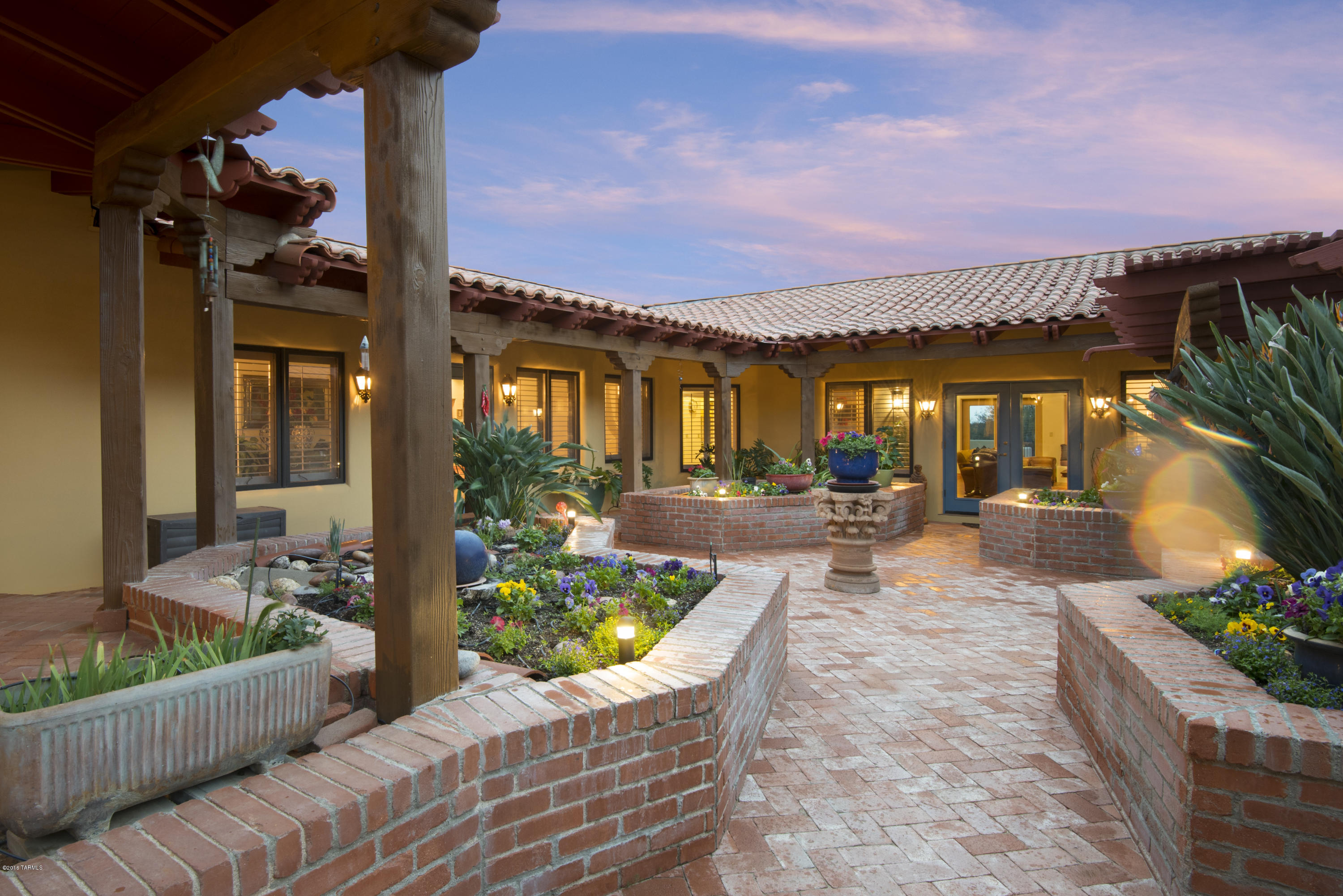 Authentic Hacienda Designed Home Loaded w/charm & detail situated on a near 2- acre private lot in Guard- Gated Cat #10.  Enter thru a charming, expansive Courtyard w/Flower beds, French Doors & Fountain. Galleria Entry to Spacious Living Rm w/FP & 400+ bottle Wine Rm. Wonderful detail thruout, Beamed Cathedral & Coffered Ceilings, Carved Corbels, Italian porcelain tile,
Bright & Open Kitchen, Oversized Granite Island, Decor SS & Sub Zero Appliances, Bay Window Breakfast Area,
Breakfast Bar, Open to Family Rm w/FP.  Spacious Master Ste w/sitting area & 2 way FP.  His & Hers Walk-In Closets. Stunning City & Mtn Views, Masonry Stucco,
Pella windows, Central Vac, Reverse Osmosis & 3 zones of A/C replaced.  Outside- Deep Wrap-around Porches,
Ramada, Pool redone in Pebbletec, 3 Car Garage.