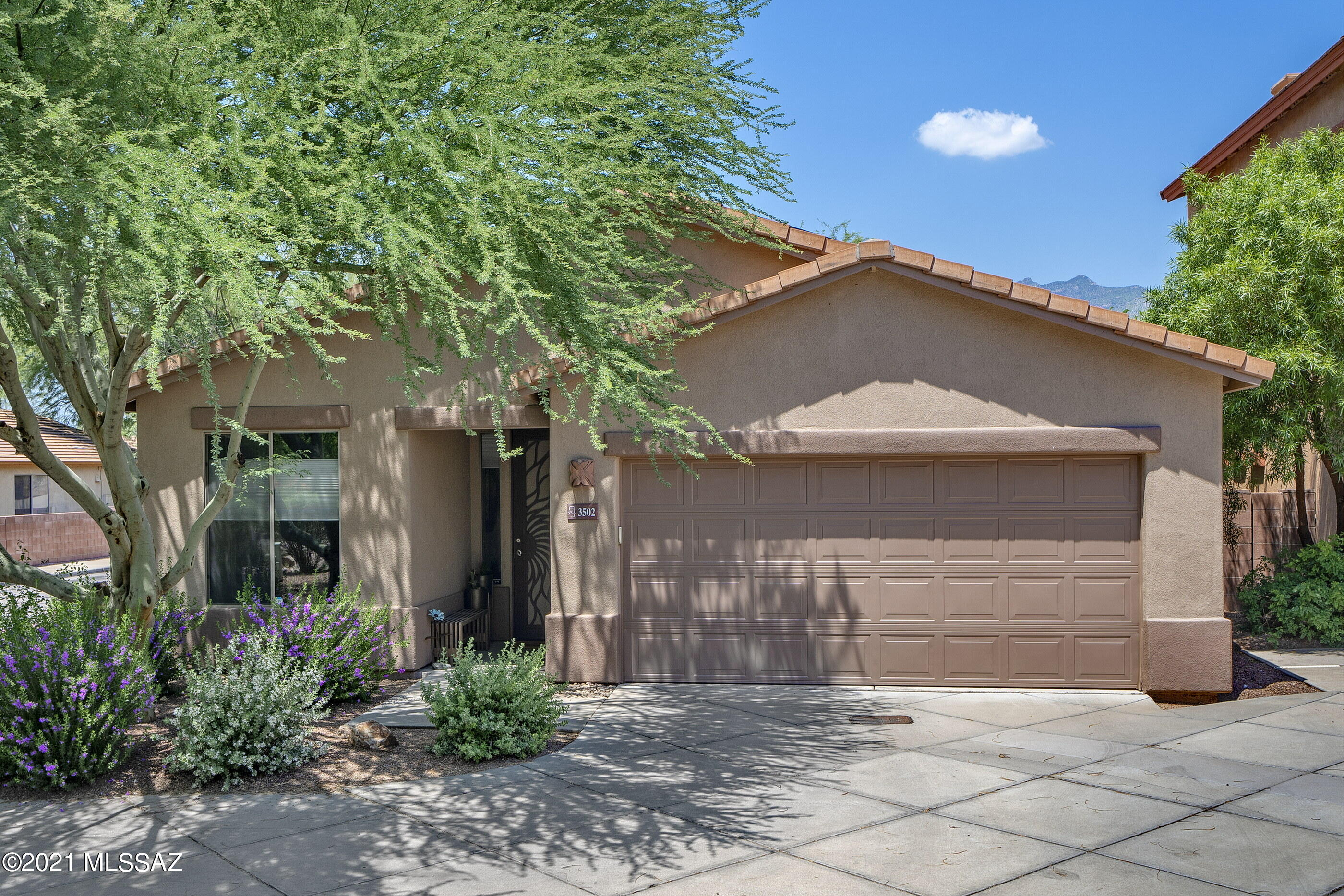 This stunningly updated home is conveniently located within a private gated community in the Central Tucson corridor! This 2 bedroom and 2 bath home has pride of ownership that is evident throughout! Located in the highly sought after community of Hacienda Del Rio, one is close to a collection of goods and services, including shopping, fine and casual dining, the Rillito Riverwalk and ''The Loop'' bike path, incorporating 131 miles of paths linking Tucson to its communities. Enjoy leisurely strolls on the sidewalks and paths of this beautifully landscaped community, or relax and unwind in the refreshing pool and spa. Updates include new ceramic tile, custom blinds, extended patio pavers, interior/exterior paint... the list goes on!!