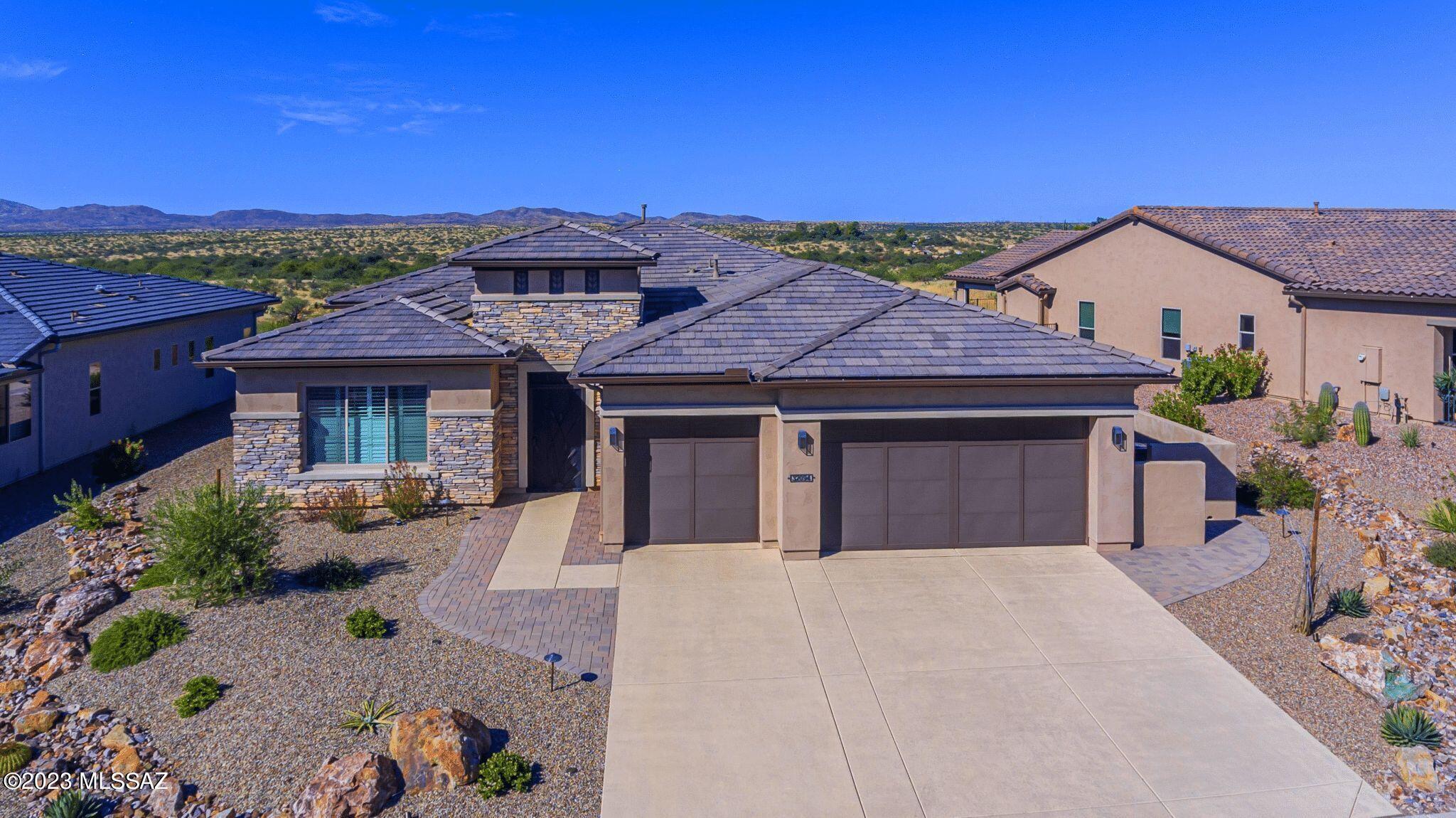 A rare opportunity awaits you at SaddleBrooke Ranch!Captivating views while you marvel in the tastefully appointed features of this sought-after Vienta floorplan.Open airy Kitchen,Great Room & Dining area w/unobstructed mountain & desert views.Stunning kitchen w/gorgeous island, large walk-in pantry & gas cooktop.More views from Primary bedroom!Ensuite Bath w/frameless shower,soaking tub & large linen closet.Guest Room ensuite in split floorplan for everyone's privacy.Glass French doors enclose the oversized Den/Office.Quartz Countertops throughout,built-in Wine Bar,Powder Bath & Laundry w/storage.Full size 3 car extended garage w/epoxy floor.Enjoy Arizona's ever-changing sunsets by a built-in Firepit.This enchanting home was completed in 2021.Furniture available on separate bill of sale.