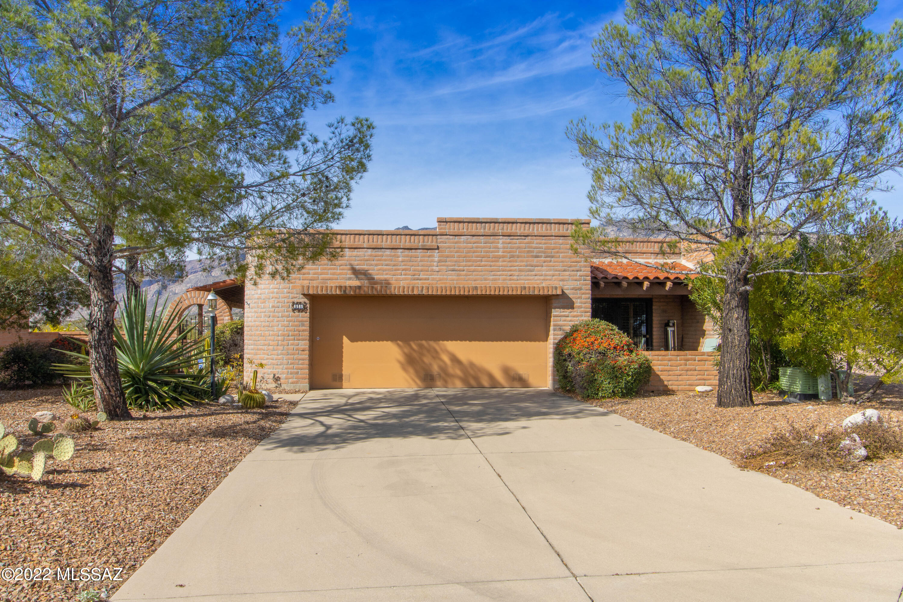 Views, views, views, come see this fantastic property located in the highly desirable Sunrise Territory Estates. Take in the beautiful unobstructed views of the Catalina Mountains and city lights as you relax under the covered patio or by the pool and spa.  Pool decking redone in 2016 and coated with a cool deck. Interior fully redone in 2015 with high end features including beautiful new floors in the main living spaces, corner cozy beehive fireplace, and custom Plantation shutters. Kitchen boasts quartz counters, gas range,  built-in microwave all open to a spacious kitchen nook. Generous sized master suite complete with walk-in closet, dual vanity and access to the backyard.  Move in & enjoy the best of Tucson Foothills living!