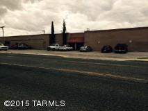 Warehouse for Indus/office/retail close to downtown, Pima college, charter schools and freeway in a business growing area. Corner lot with rear loading ramps, plenty of parking in front of warehouse and parking on street. Zoning allows for many uses. This warehouse has 2 separate tenants with 2 separate utility set ups, that are on a month to month lease totaling $3500 per month. Tenants willing to move or stay. Plenty of parking for whatever your needs are.