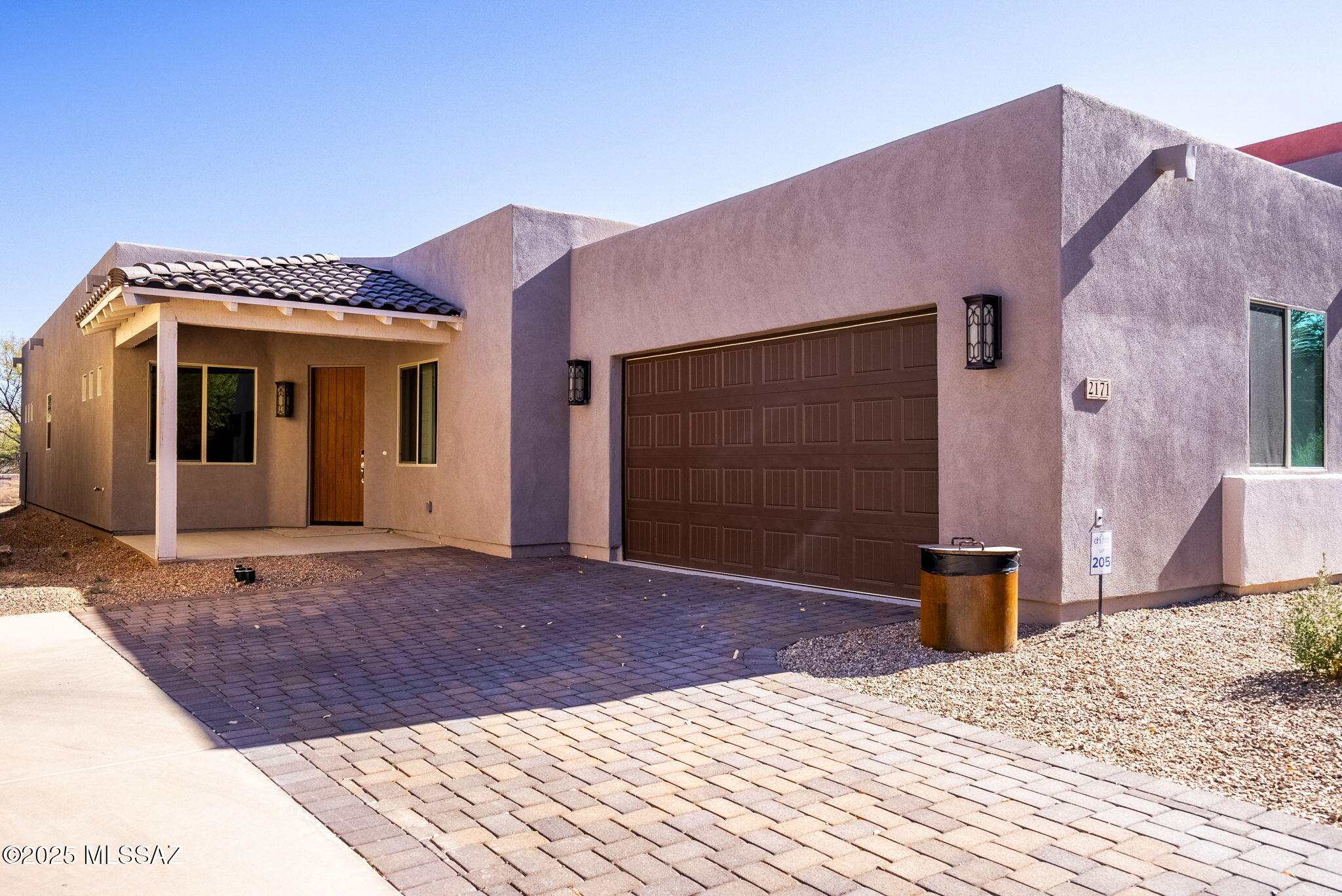 Nestled near the Anza Trail, this 2-bedroom, 2-bath new construction home from Evermore offers the perfect combination of indoor elegance and a breathtaking natural setting. The sophisticated San Xavier floorplan is thoughtfully designed for modern living and timeless charm. Abundant natural light flows through the open-concept layout. Kitchen and great room create an inviting gathering space for every occasion, with cozy stacked stone fireplace and direct access to covered terrace and courtyard. Flexible bonus room is ideal for home office, creative studio or third-bedroom conversion. Tranquil primary suite offers spa-like en suite bath and walk-in closet. Community clubhouse and pool provide recreation and relaxation while the surrounding area offers access to outdoor adventure.