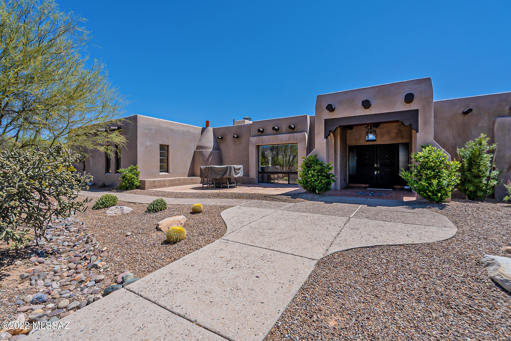 Gorgeous setting from the large front patio and charming fireplace perfect for comfortable front yard gatherings.  Spacious split BD floorplan. Lavish Master Bath featuring lots of stone work and huge shower and walk-in closet. So peaceful and serene. Gourmet kitchen with top of the line s/s appliances, lots of wood accents, French doors lead to over-sized formal dining room with coffered ceilings, and even a private wine room. Brick fireplace a and built-in bookcases in the Family room.
Step out to the backyard and you'll love seeing the large pool and spa over-looking the stunning mountain views from this elevated homesite. 
Outdoor kitchen and all on horse property.
Don't miss the neighborhood lake (catch and release) which is only a short drive.