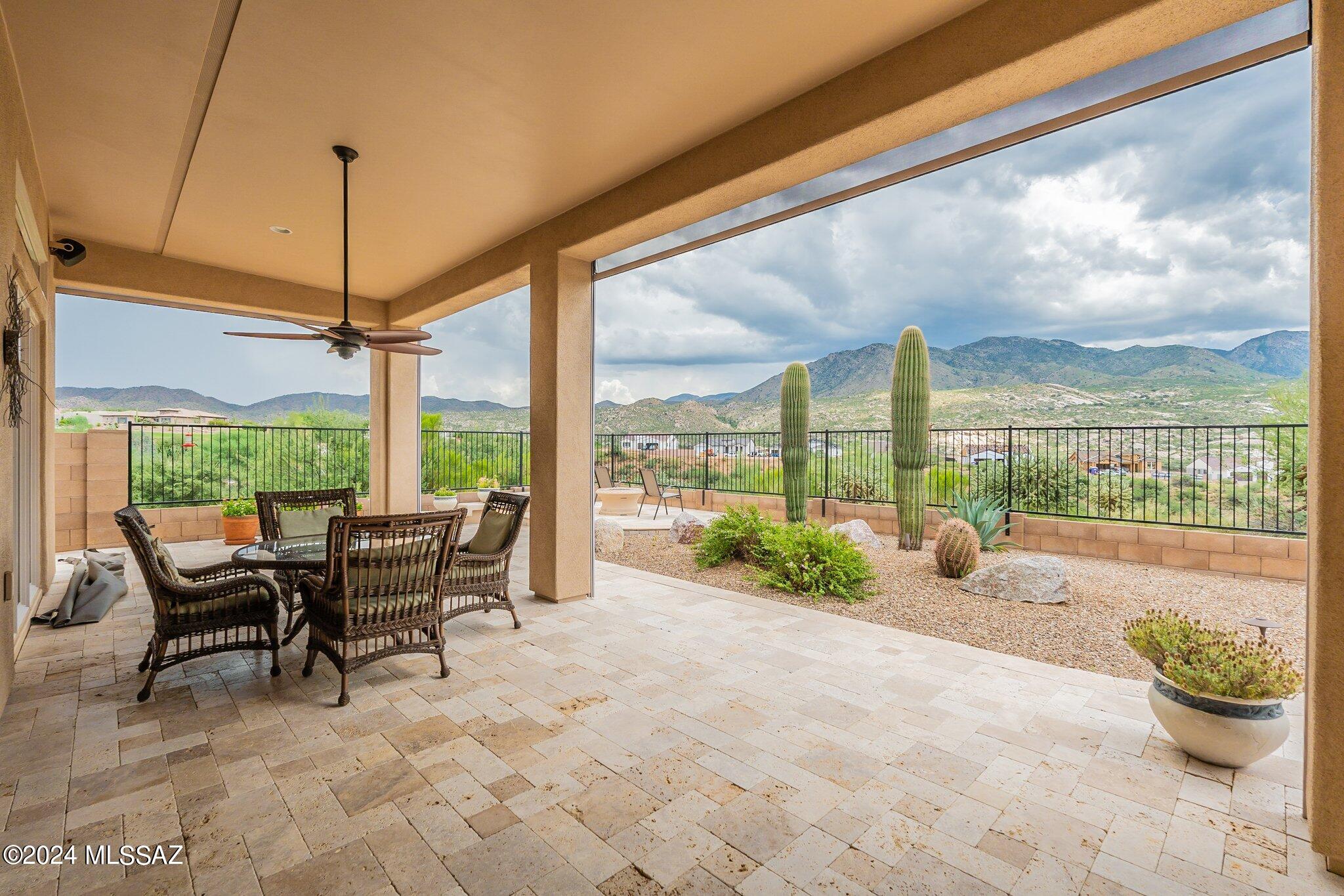 Sitting above The Preserve golf course in SaddleBrooke, this SONORAN model w/casita backs east - unobstructed mtn views. Enter private courtyard to captivating mtn views thru front door - glass panels across back bring the outside in! Great room w/gas fireplace connect to chef's kitchen w/gas cooktop, pot filler, dbl oven, convect MW - perfect entertaining space. Butler pantry/wet bar, wine fridge, walk-in pantry. Mtn & fountain views from dining room & den. 18'' tile through living spaces & casita; carpet in primary and 3rd suite. Primary suite w/sitting area, soaking tub, split vanities, shower, walk-in closet. Travertine patio w/retractable screens, spa/water feature, side yard. Fabulous tiled 4 stall garage, cabinets, fridge, sink. Kinetico whole house filter. Spool water feature!