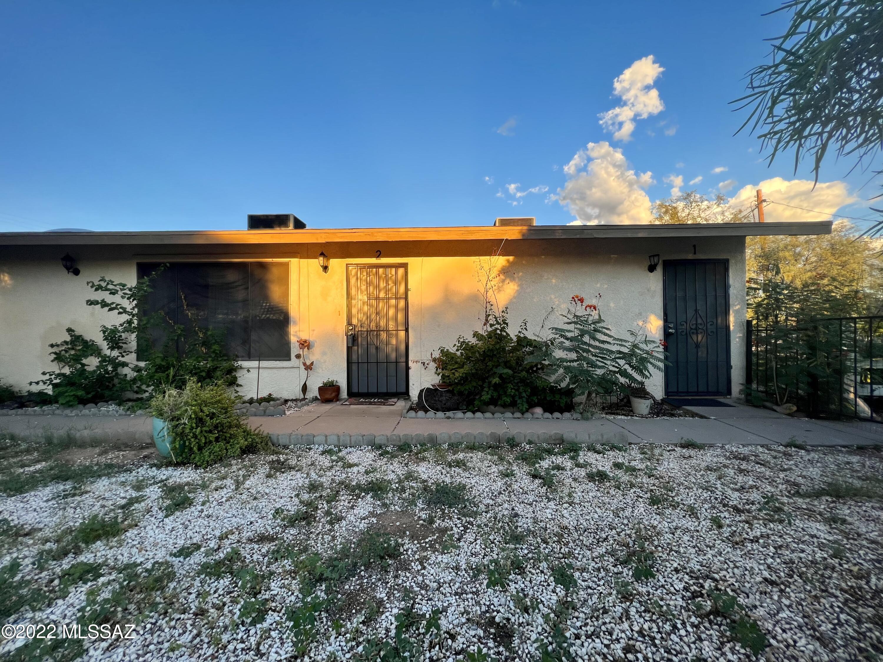 Incredible opportunity to purchase an updated 2/2 home with attached 1 bedroom, 1 bathroom  in south Tucson. Two spacious homes. The main home consists of 2 bedrooms, 2 bathrooms and separate living and family rooms. There's beautiful Vaulted ceilings, skylights and neutral paint tones throughout. Kitchen with lots of cabinet and counter space and a breakfast bar. Low maintenance tile flooring in all common areas. Offering plenty of space for storage. Both homes have brand new gas system, AC & heating systems, tankless water heaters, all new electrical throughout, LED lighting. Main home has brand new dishwasher (2021) and R/O system, huge 1/3 acre corner lot with lots of parking space, an extended two car garage and a covered patio. With a new block wall and great room to entertain and enjoy Tucson amazing sunsets. The guest home is a 1 bedroom, 1 bathroom with a great-room floor-plan. Tile flooring throughout. Near freeways, schools and shopping. Live in one, rent the other, whatever you choose this property will not disappoint. Use both as long or short term rentals. Lots of possibilities and excellent opportunity for extra income. Don´t miss it. Reference MLS #22224017 for Multi family listing.