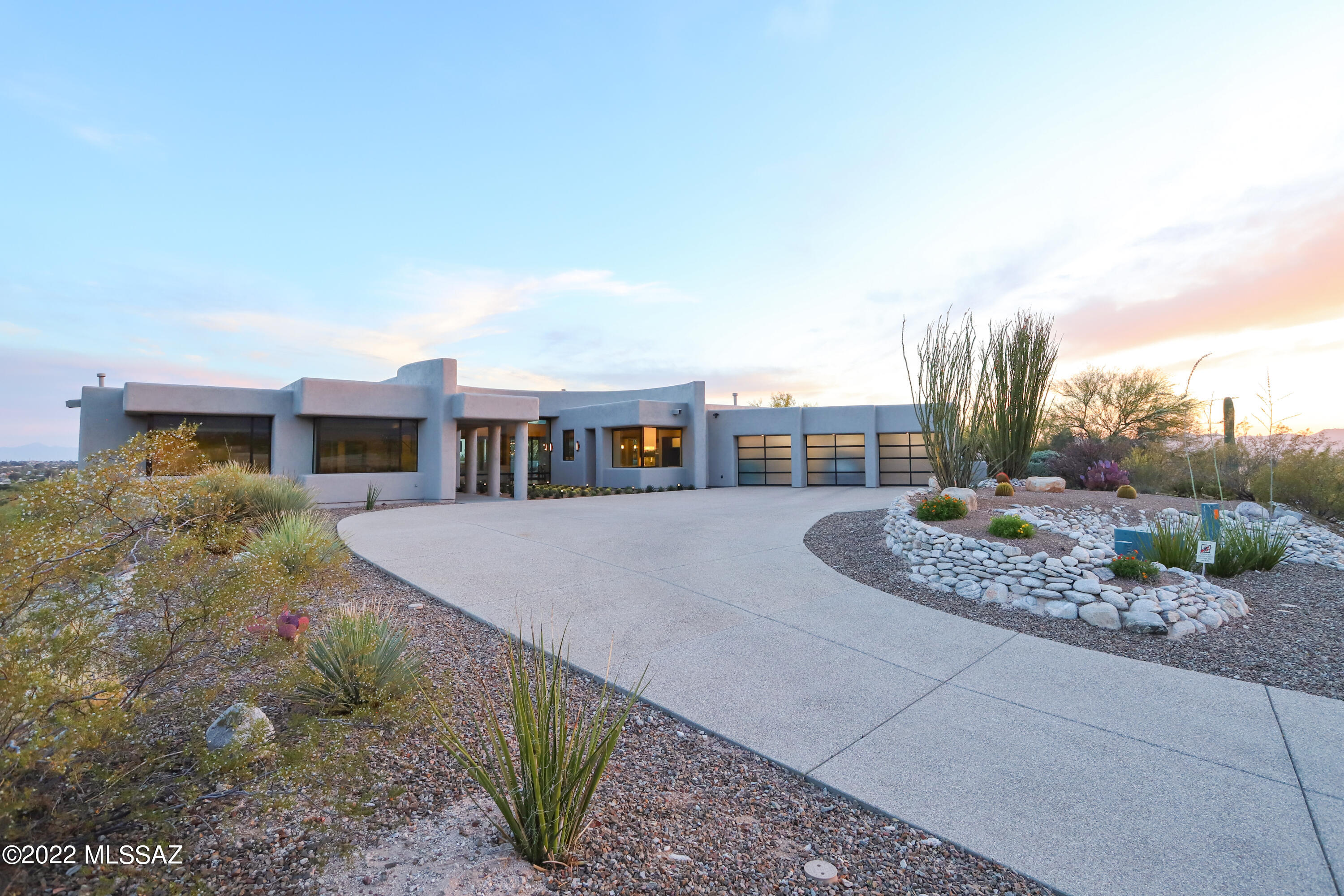 Purposefully and Intentionally remodeled. A modern, yet contemporary home designed by architect Kevin B Howard. Soaring ceilings and floor to ceiling windows. 10ft tall sliding glass doors bring the outside in. North facing motorized interior shades. Custom Rift cut oak doors. Legrand switches/plugs. Structured wiring (Ethernet available). Sub Zero Wolf appliances, microwave drawer, undercabinet lighting, Brookhaven cabinetry, Butler's pantry, wine refrigerator, glass backsplash and prep sink. Quartz countertops throughout. All new Milgard and Western windows. Primary bathroom boasts a soaking tub and grand walk-in shower with lipless entry. Primary bedroom has an exquisitely customized walk-in closet as well as a one-of-a-kind hand crafted, oversized pocket door. Many custom features... All can lighting is LED, Custom glass and steel pivot entry door, porcelain tile throughout, central vacuum, hard wood floors in office, epoxy garage floor, custom metal and glass garage doors, professionally designed landscape in backyard which includes two viewing decks, a gas fire place,  a modern water feature and an infrared barbecue.