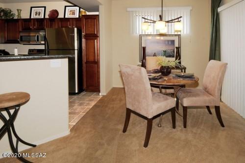 Beautiful one bedroom one bath condo in the ideal location of Rio Del Sol !. This one bedroom one bath features granite countertops and stainless steele appliances. Very well maintained as it was used as a corporate rental. Community has entrance to the River Walk with biking and running paths.  Community features two pools, spa and onsite fintness center. Minutes to Tucson Mall, St. Phillips Plaza , The University of Arizona and the Farmers Market !   Furnishings can be sold on a sperate bill of sale. Offers for furniture and housewares being accepted separately.