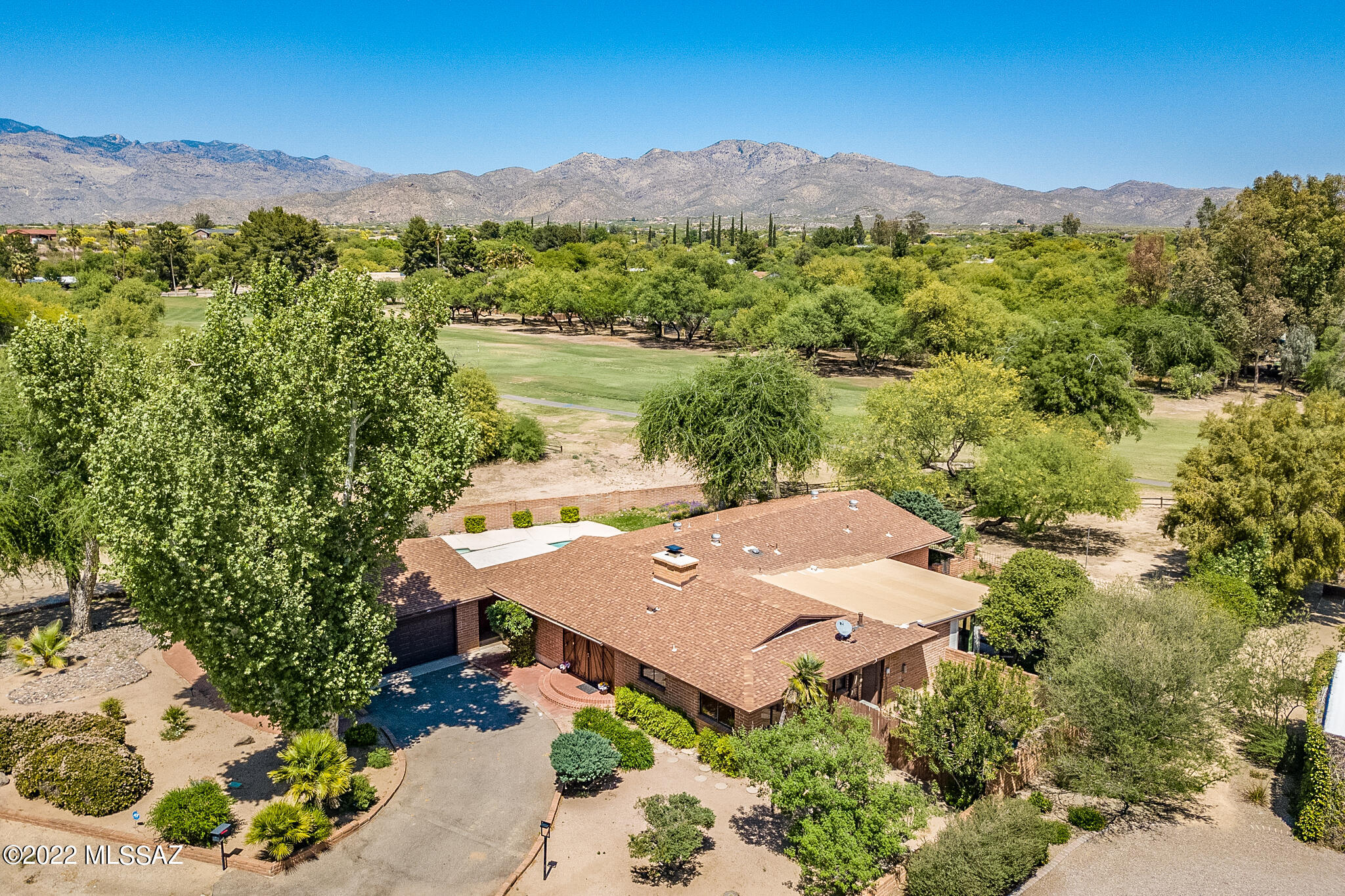 Beautiful, updated Mid-Century adobe on the 17th fairway. Spacious living area, pitched wood beamed ceilings and open concept. Gorgeous kitchen with two-tone cabinetry, quartz counters and new
stainless appliances. Master ensuite with mountain views, walk-in closet, double vanity, soothing soaking tub and separate shower with custom tile surround. Four bedrooms plus den/home office/workout
room. Covered patio area off kitchen offers a putting green, built-in fire pit and golf course views. Double sliding doors off living room open to the large covered patio over-looking the pool with great views - a perfect space for entertaining. Northeast's finest golf community with many amenities. NewFlow pipe upgrade and tankless hot water heater- see attached document for additional upgrades.