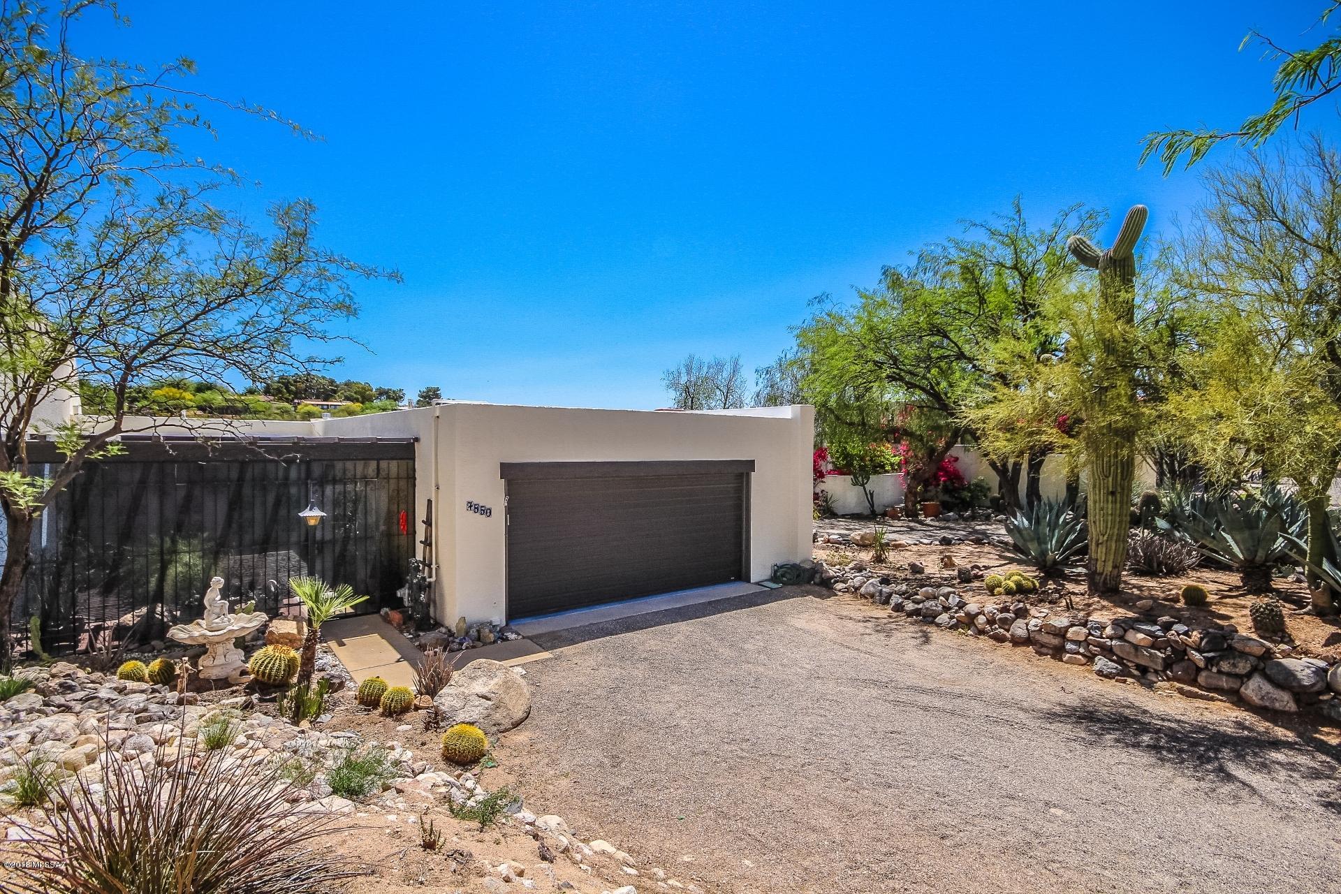 HUGE PRICE REDUCTION: $25,000 Located in the center of the Catalina Foothills, this home offers spectacular views, privacy and serenity. The open floor plan offers essentially two master suites. The private balcony from the upper master suite greets the morning sun and overlooks a vast natural area and has unobstructed views of the Catalinas and Thimble Peak. The lower ''walk out '' suite has its own sitting area, bath and 8 ft. slider to the patio area. An attached bonus room to lower suite could be a kitchenette. Two homes in one!
  The updated kitchen is spacious with a center island. Newer SS appliances set off  the beautiful granite countertops. There is plenty of light in both a breakfast area plus indoor/outdoor sitting area off of the front entrance and kitchen area. Huge great room with gas fireplace for those cozy winter nights and another 8 ft. slider with balcony. Quality wood floors in many  of the living  areas. Community pool is just across the street with both pool and spa heated year-round. Adjacent to the renowned Westward Look Resort and membership to their fitness center, spa, and tennis facilities is available.
  This is a great property for winter visitors or full-time living. You make the choice, but don't wait, the season is upon us and visitors are looking now.