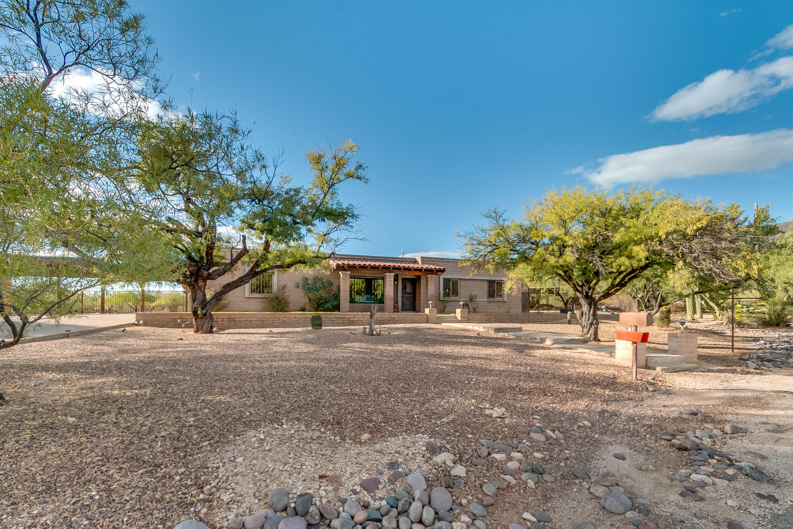 ***RANGE PRICING: $304,000-314,000***
This gorgeous ranch style home sits tucked away near the Catalina highway among the Catalina Mountains themselves. With a panoramic view that gives the homeowner both a breathtaking sunrise and sunset, this home sits on nearly an acre of land. Open and spacious living room that leads into a separate family/entertainment room. Huge laundry room for extra storage. Clean, open workshop next to the carport along with a massive yard for horses including a separate area for hay. Come check out this beauty before it's gone!