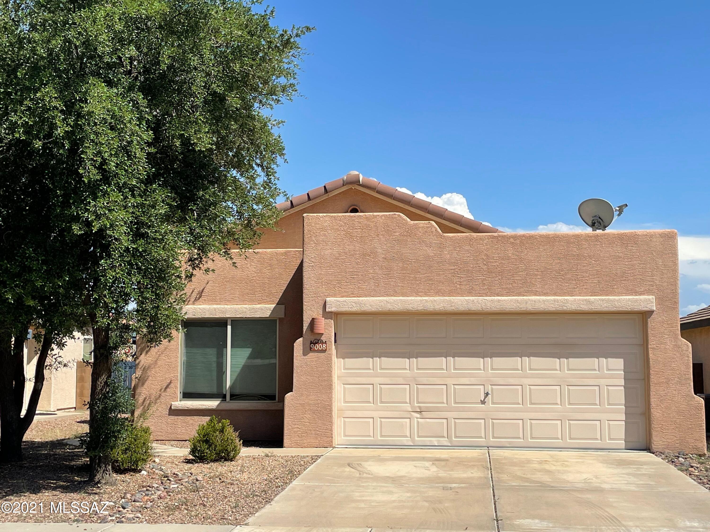 Tucked on a premium lot backing to natural wash area w/mountain views.  Custom tile in all rooms except two  bedrooms.  New interior paint, carpet and blinds awaiting your decorative flair.  The Kitchen is open to great room  and features natural wood cabinets, black appliances and eating area accented w/ designer pendant lighting & large window overlooking rear yard.  
Enter home into a large great room w/sliding rear door that ushers you to a professionally landscaped rear yard and extended  patio to enjoy mountain views and the best of AZ outdoor living.   Popular split bedroom plan w/vaulted ceilings. Master suite is completely tiled.  Master bath features large walk in shower, double sink vanity and spacious walk in closet.
Hurry don't miss this one!